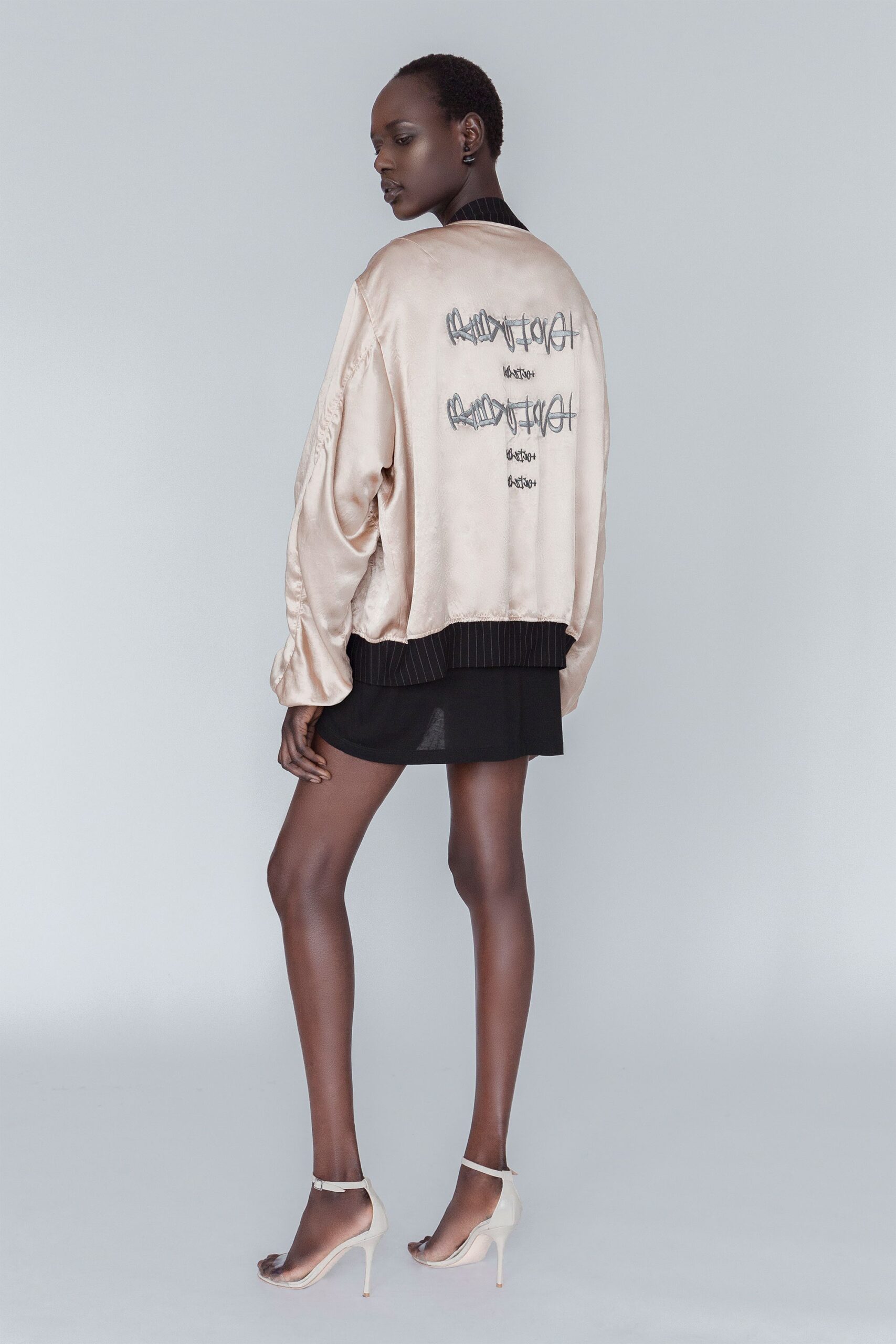 beige silk long-sleeve collared relaxed embroidered shiny jacket