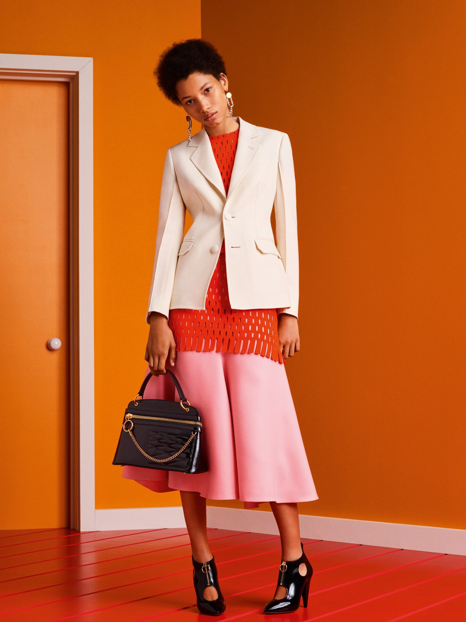 white tailored blazer with pink skirt