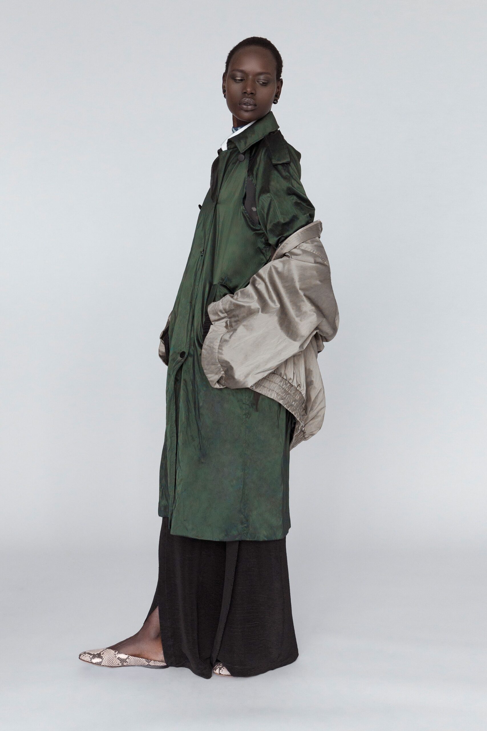 green silk relaxed coat with black skirt