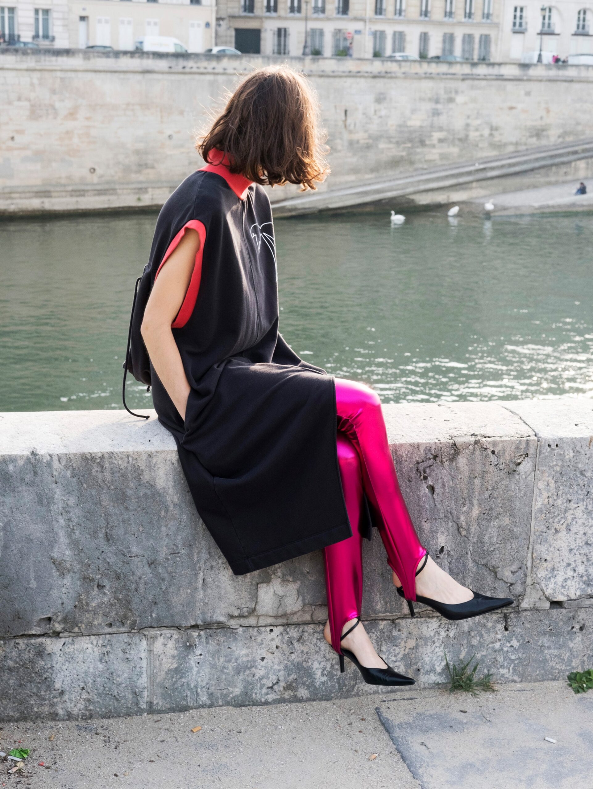 black relaxed dress with pink pants
