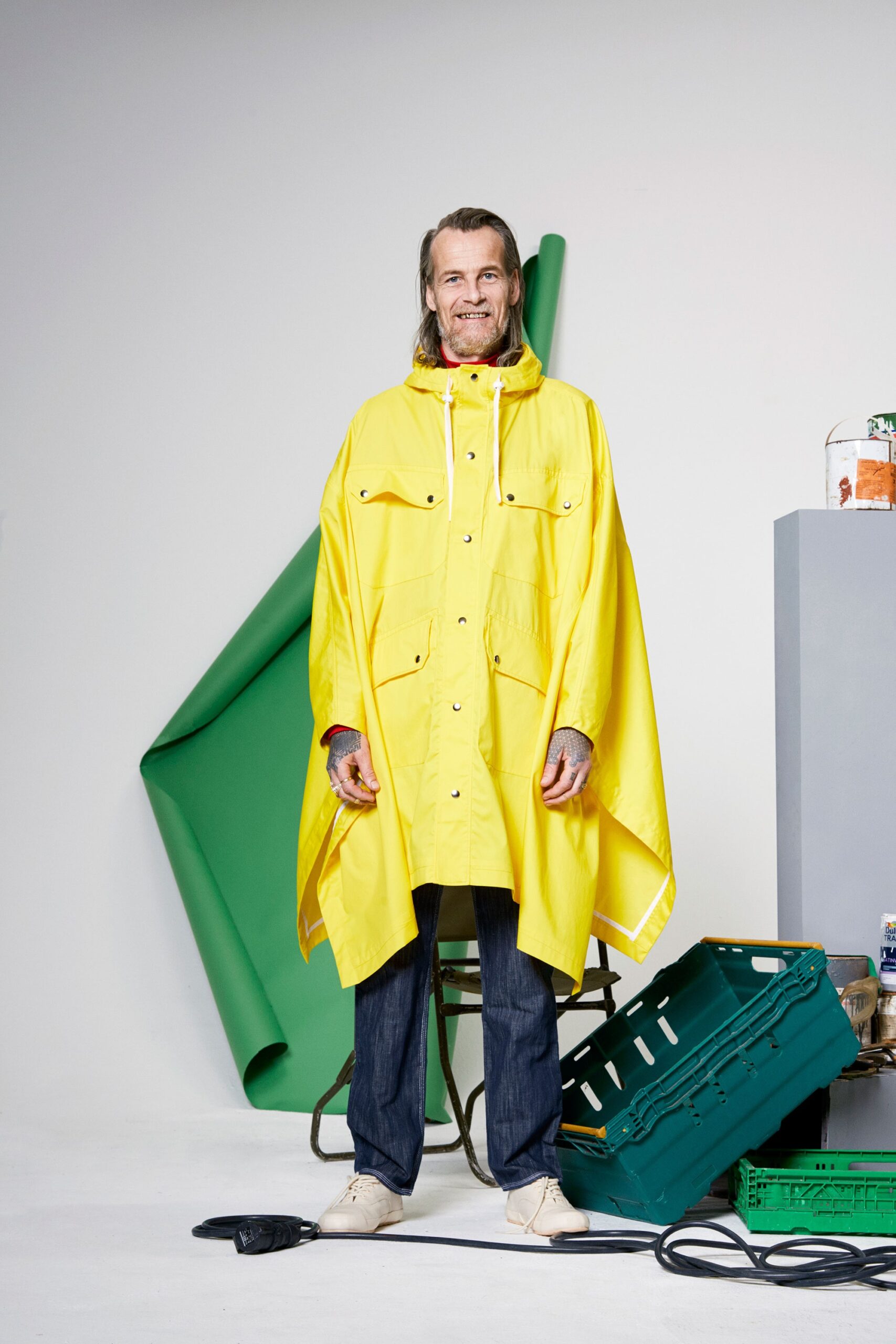 yellow vinyl poncho with blue jeans