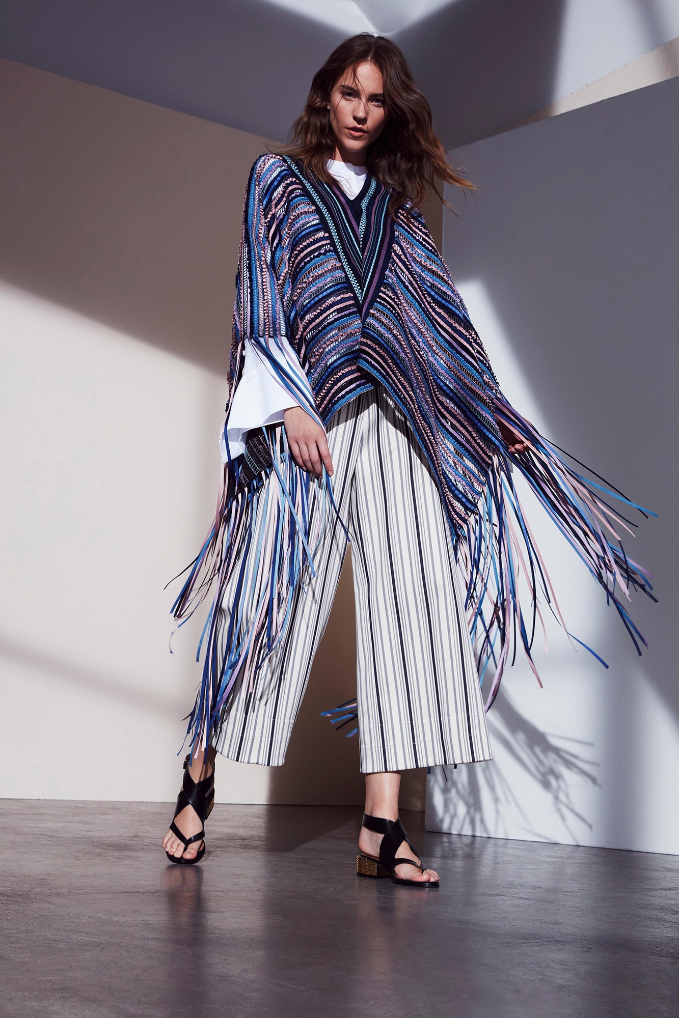 striped poncho with wide-leg pants