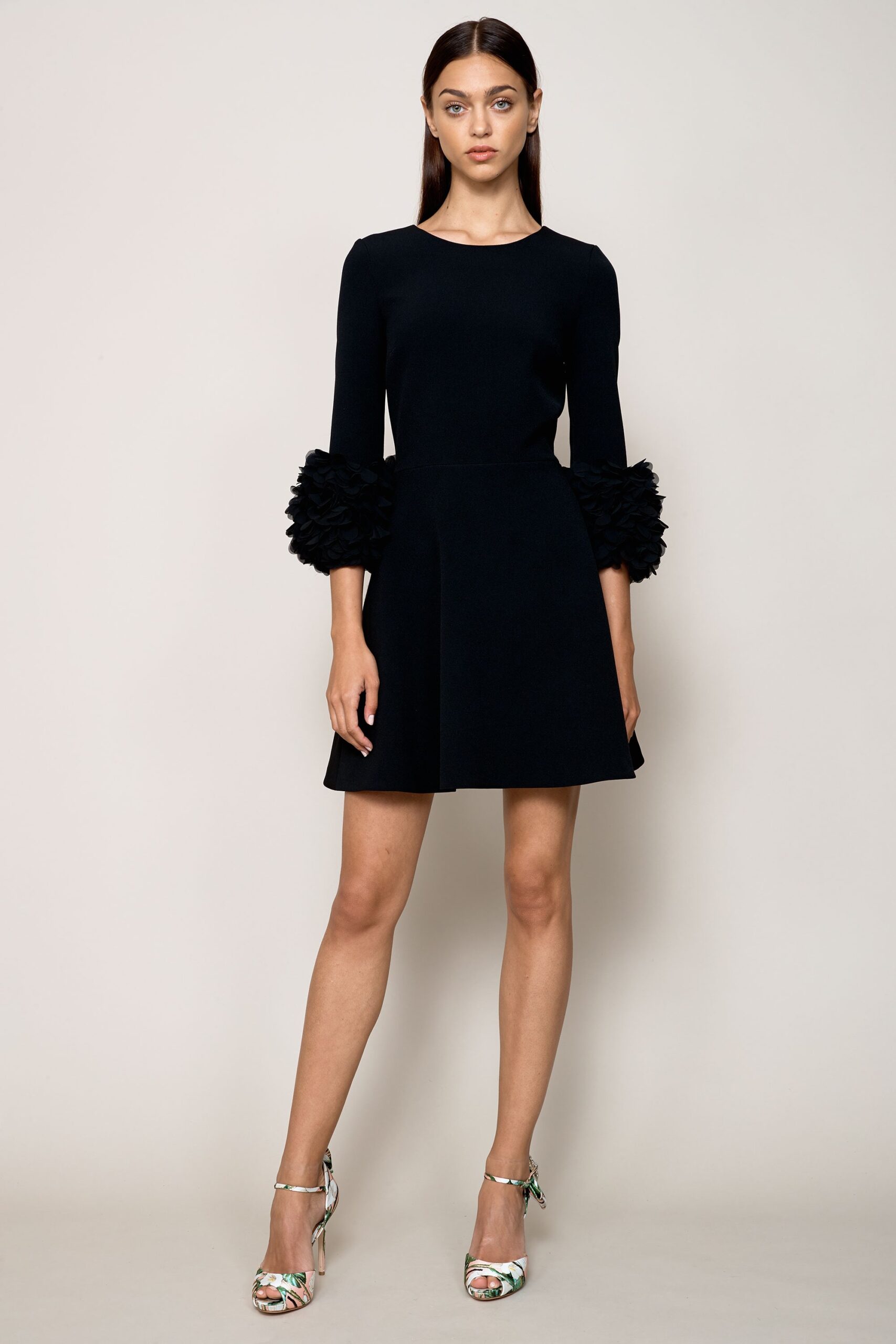 black fitted dress with ruffled sleeves