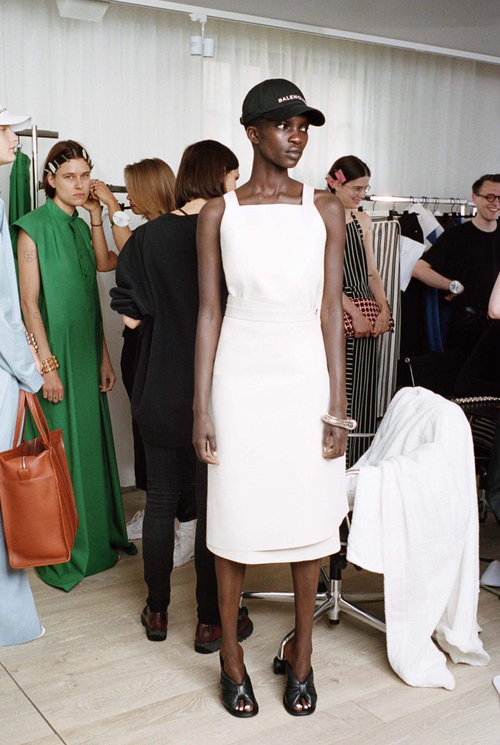 fitted white midi dress with cap
