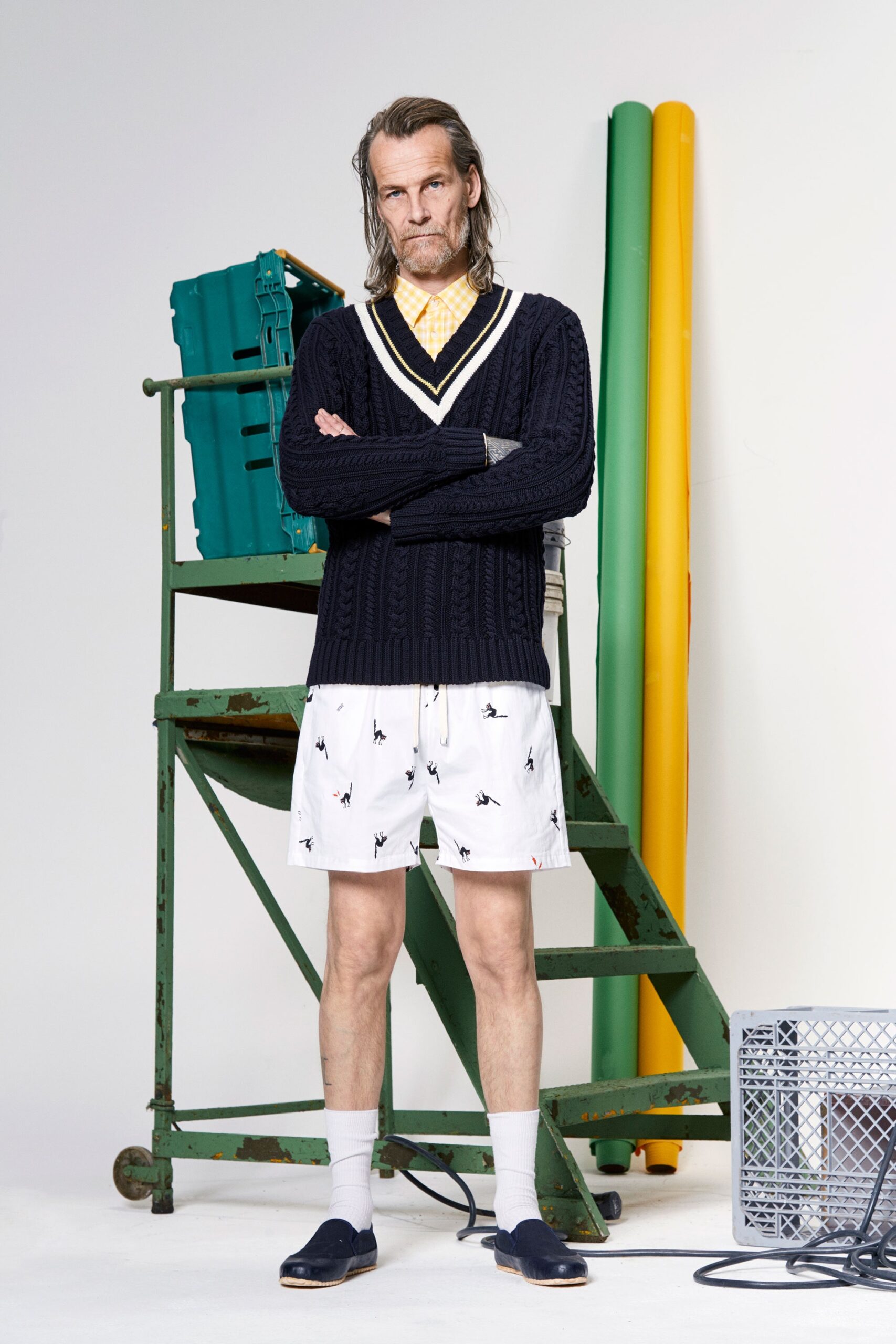 navy sweater and white shorts