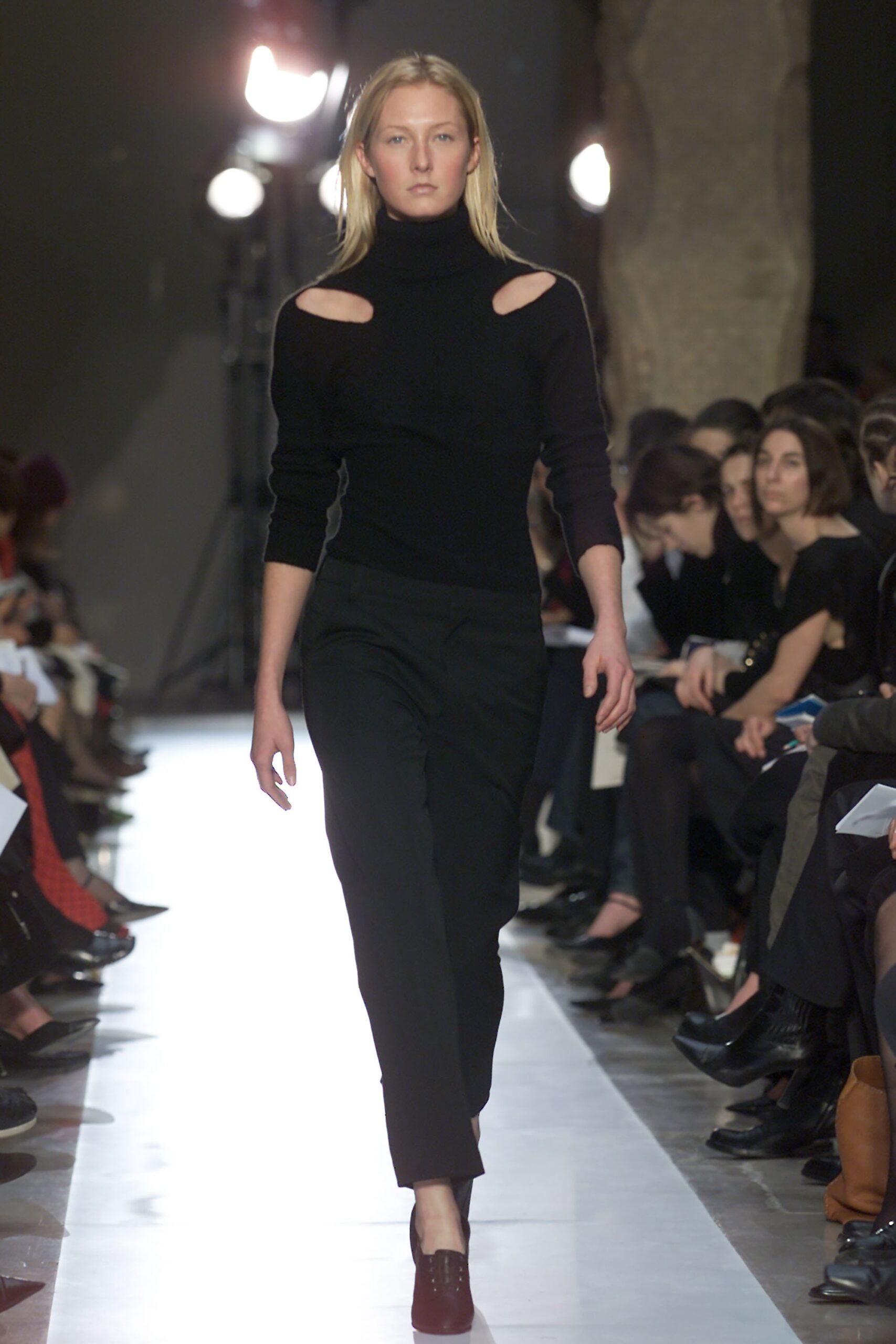 black fitted top and slim pants