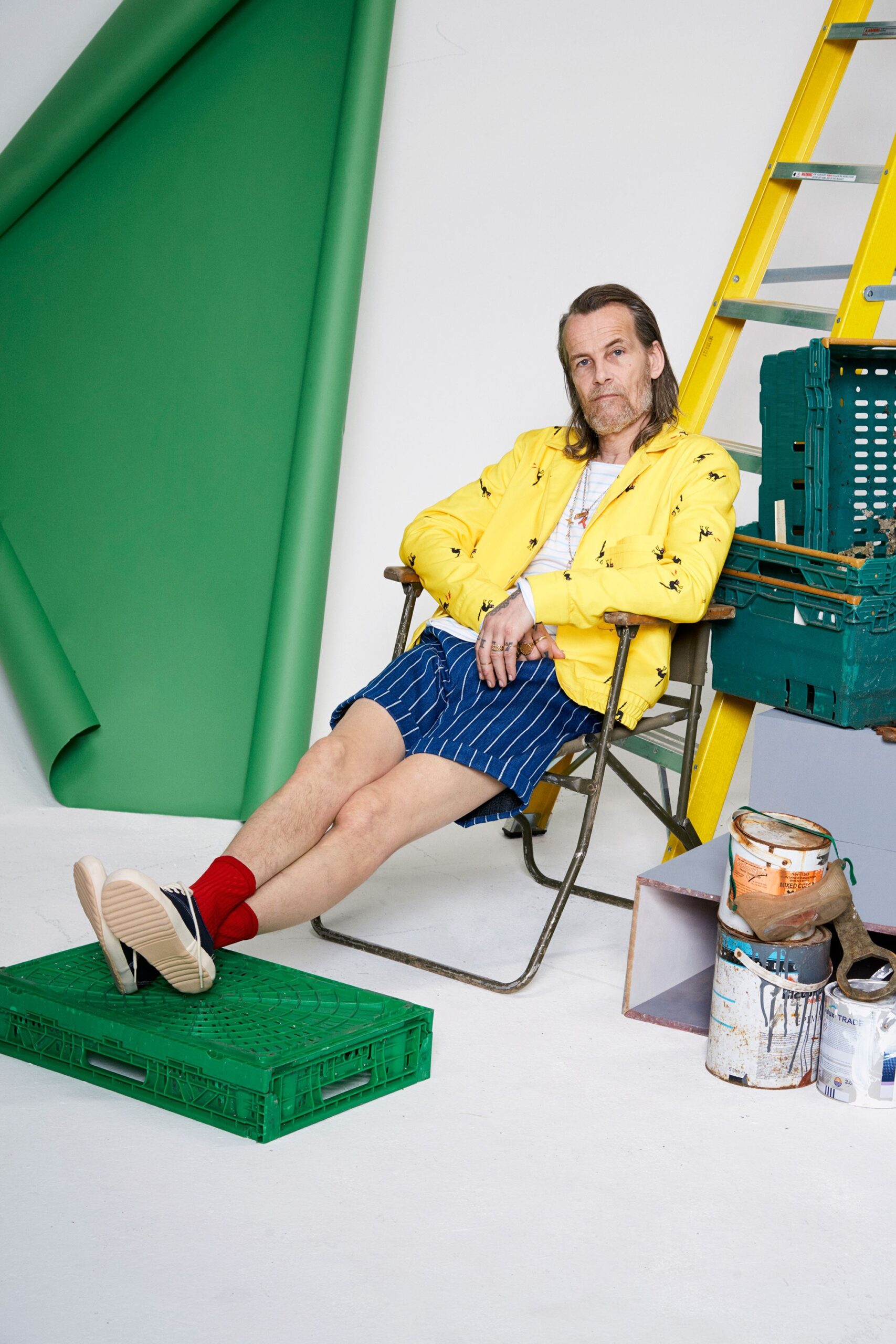 yellow jacket with blue striped shorts