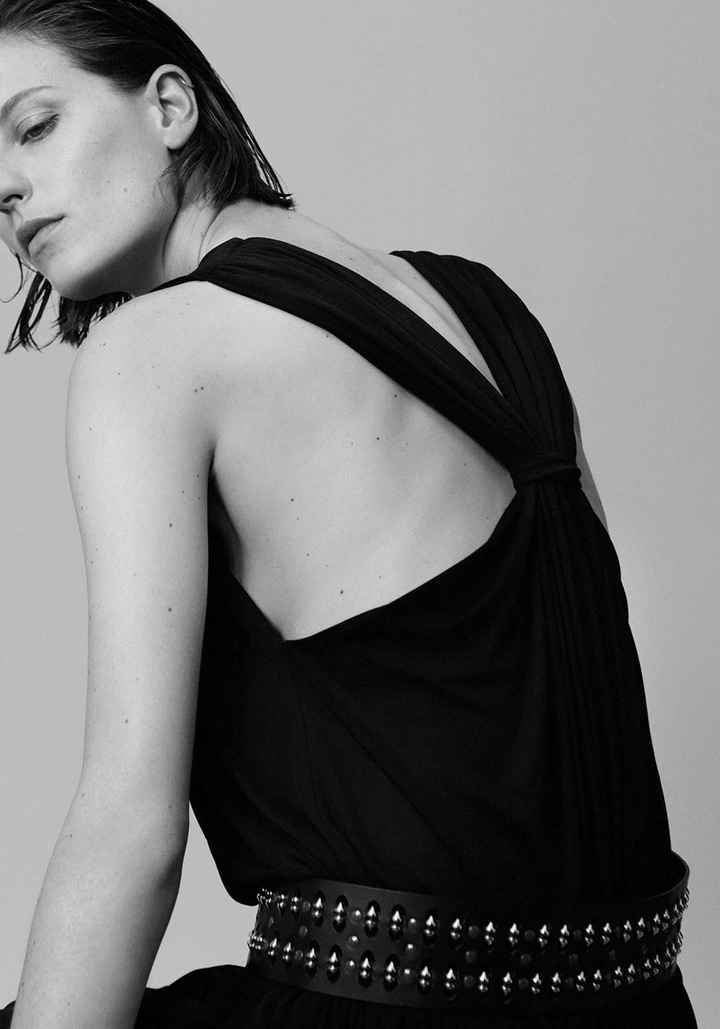 black silk draped dress with embellished belt