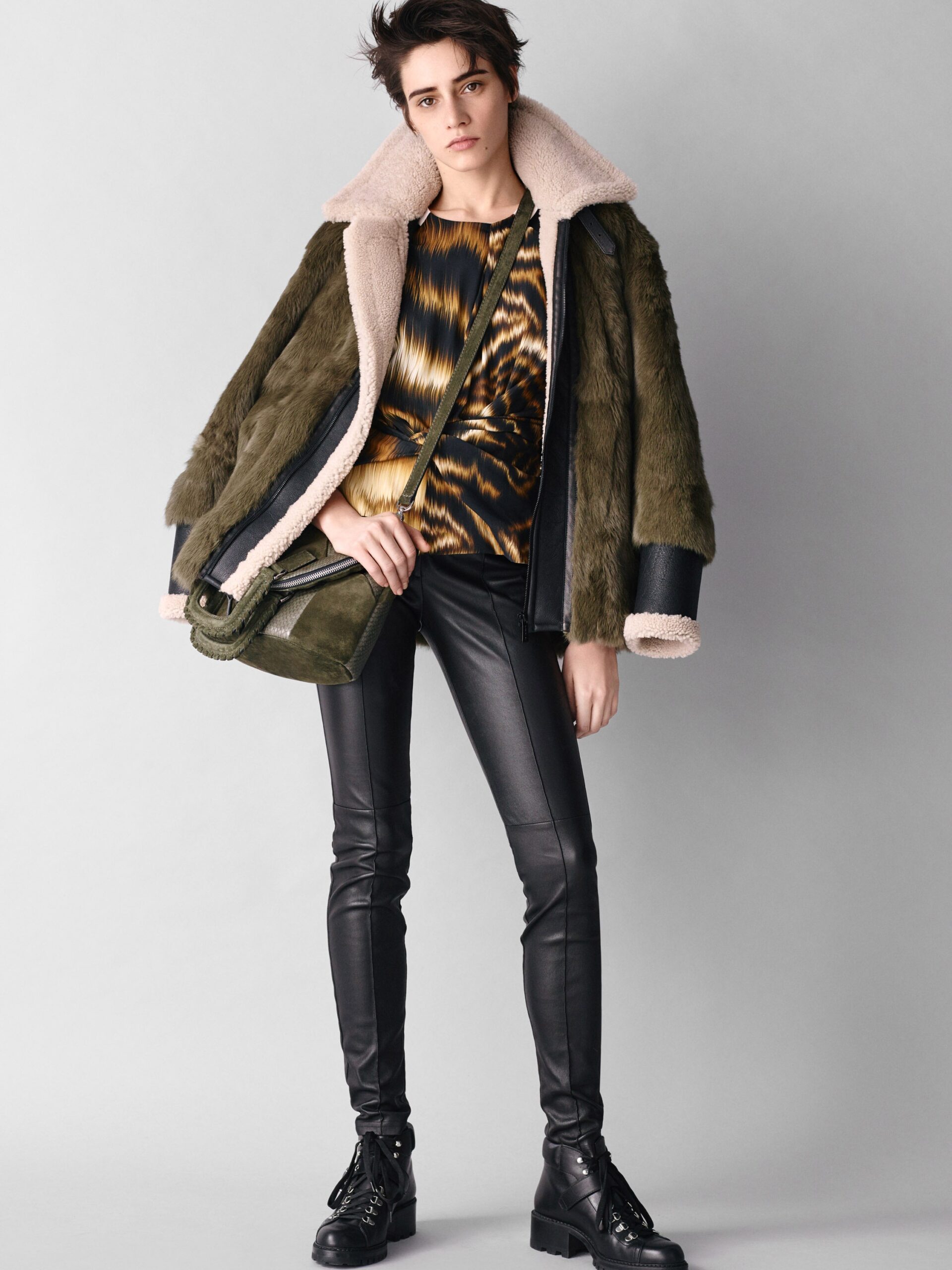 green faux-fur coat with printed top