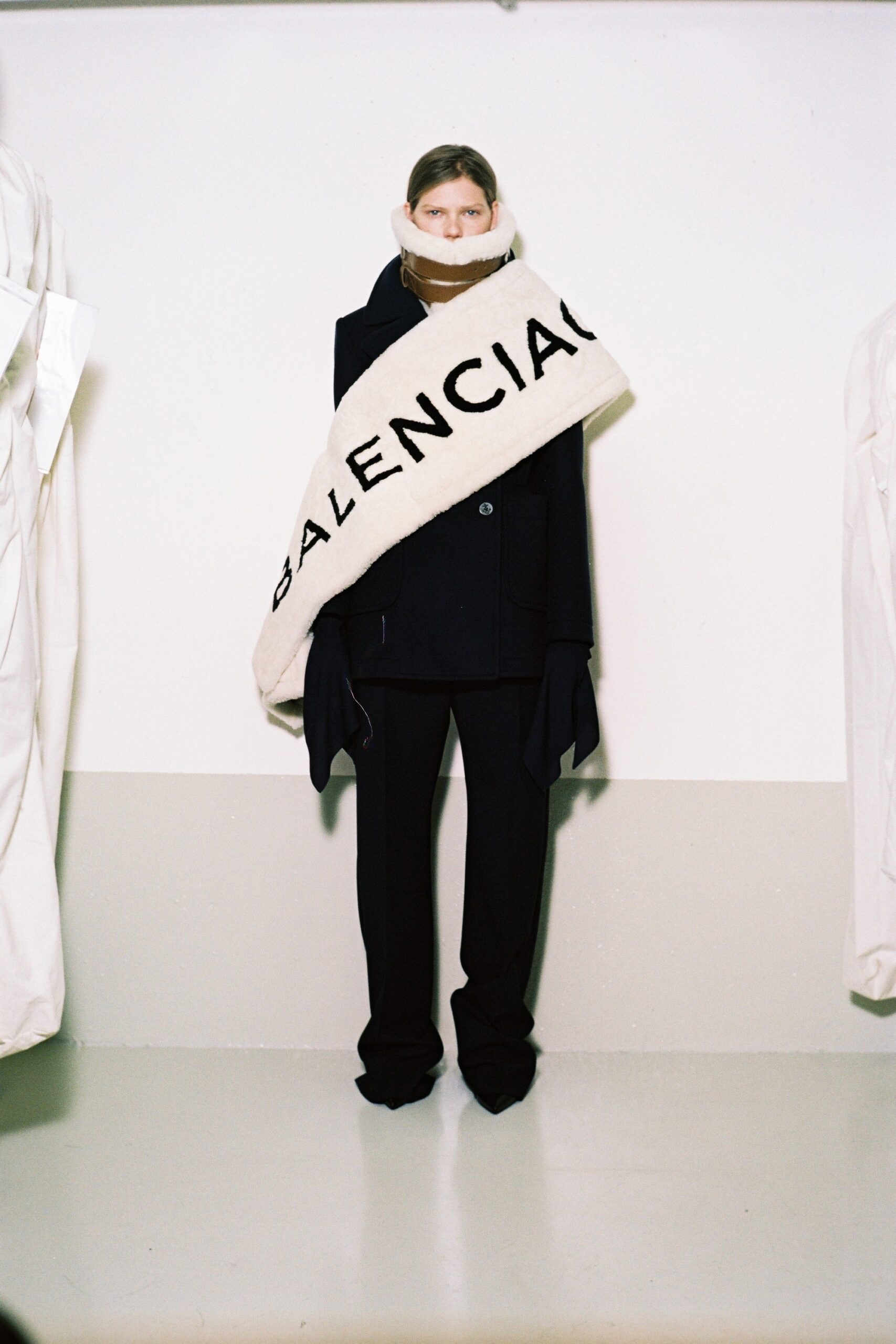 black wool coat with oversized scarf