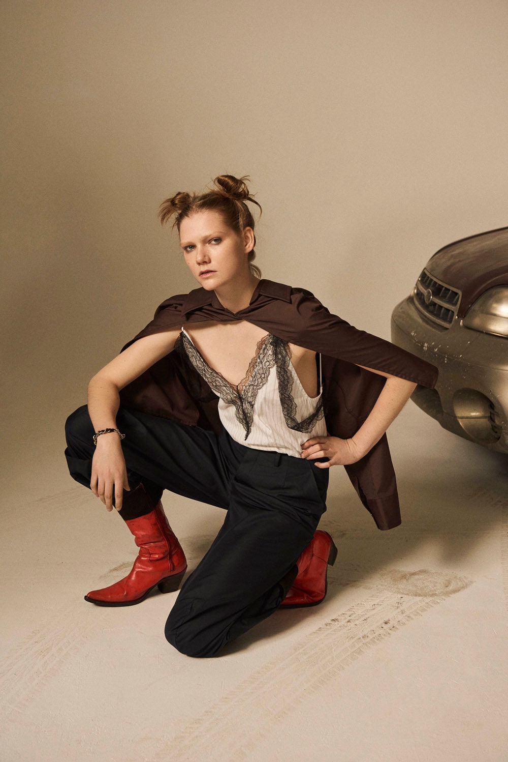 white ruffled blouse with brown jacket