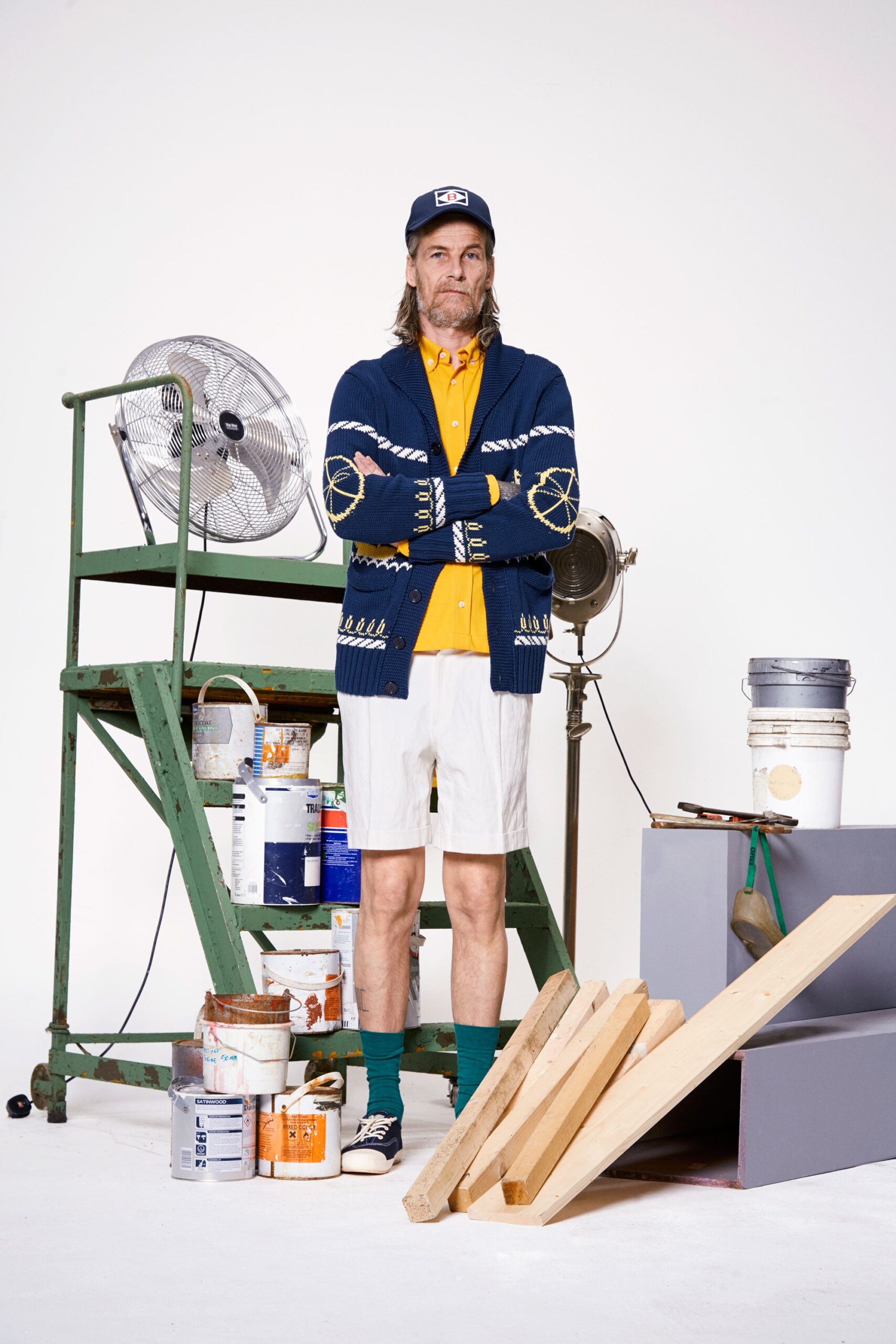 blue cardigan yellow shirt white shorts