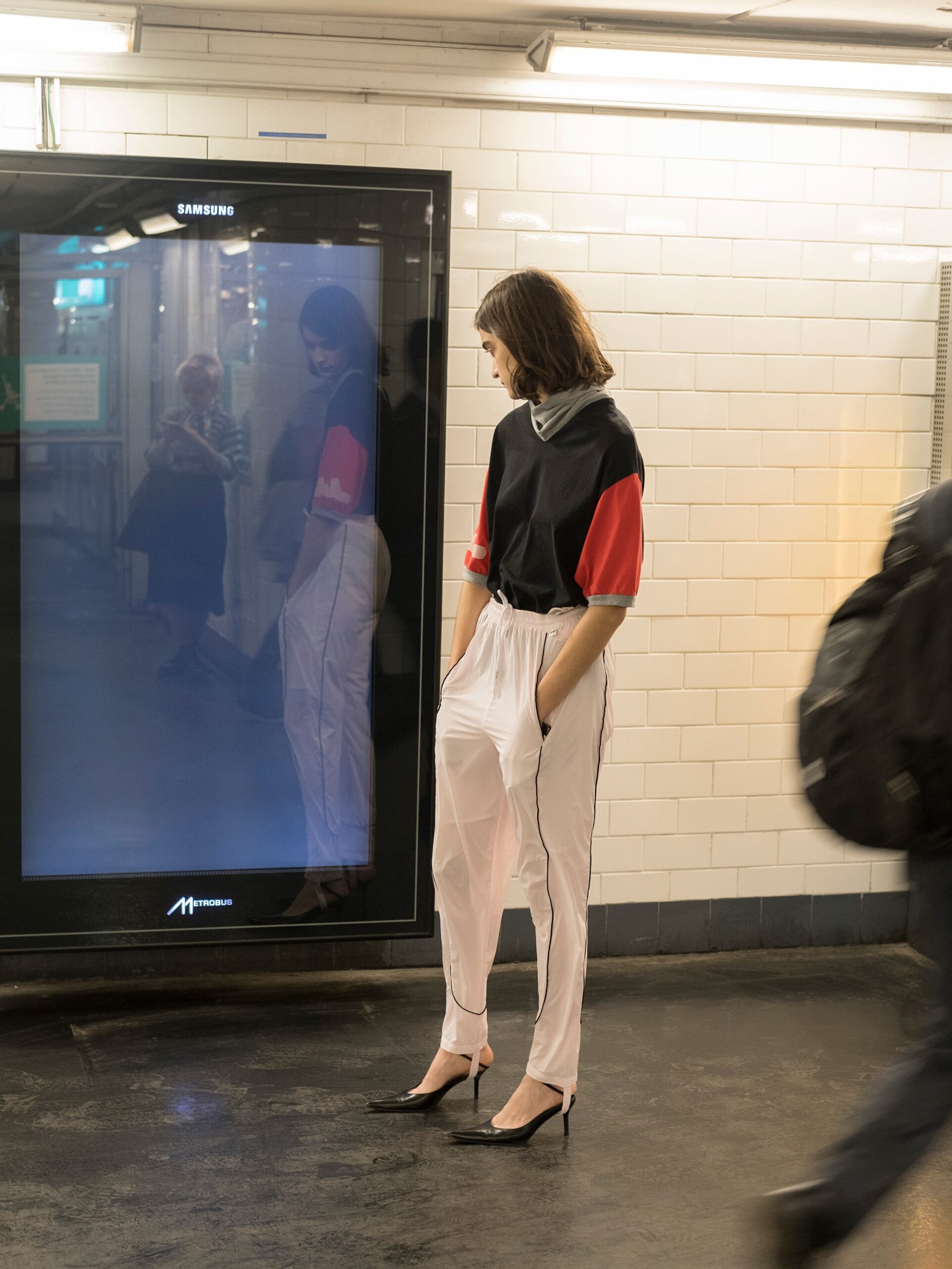 relaxed black and red top with white pants