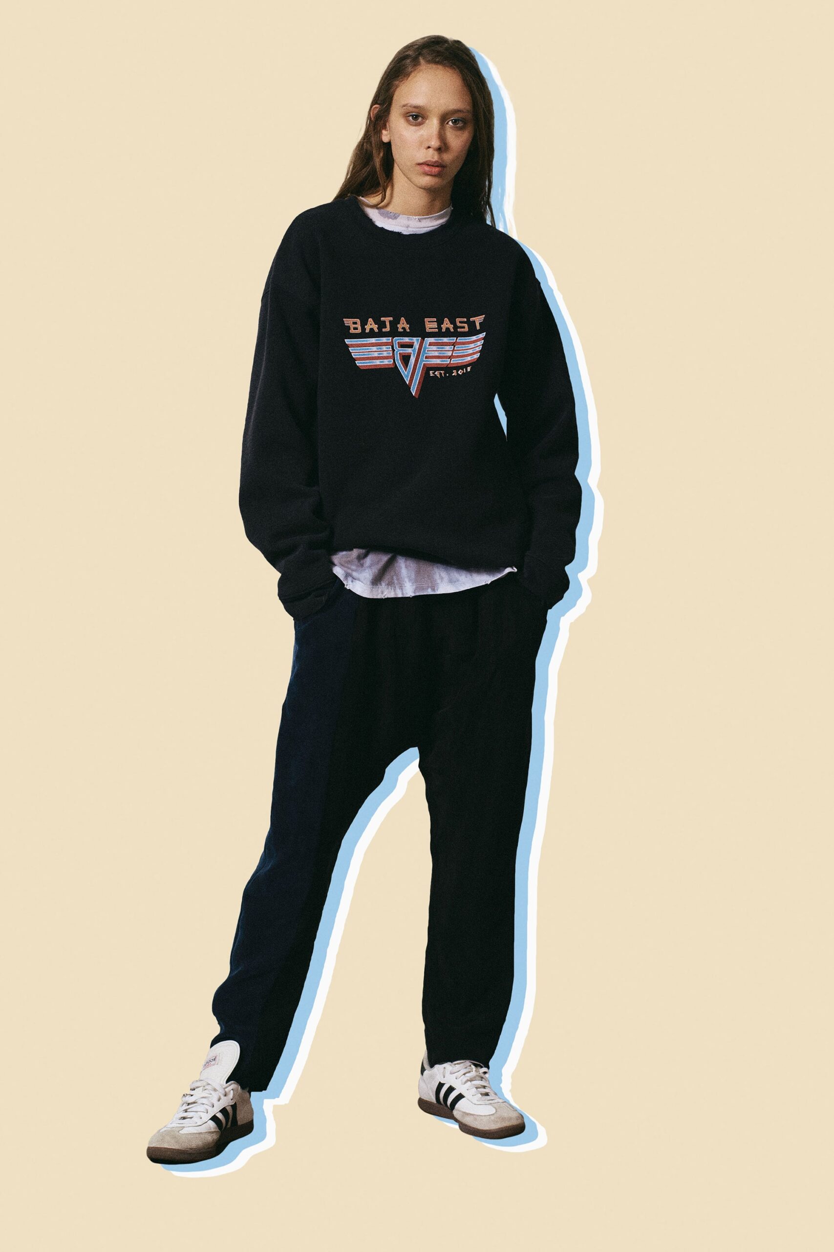 black relaxed sweater with navy pants