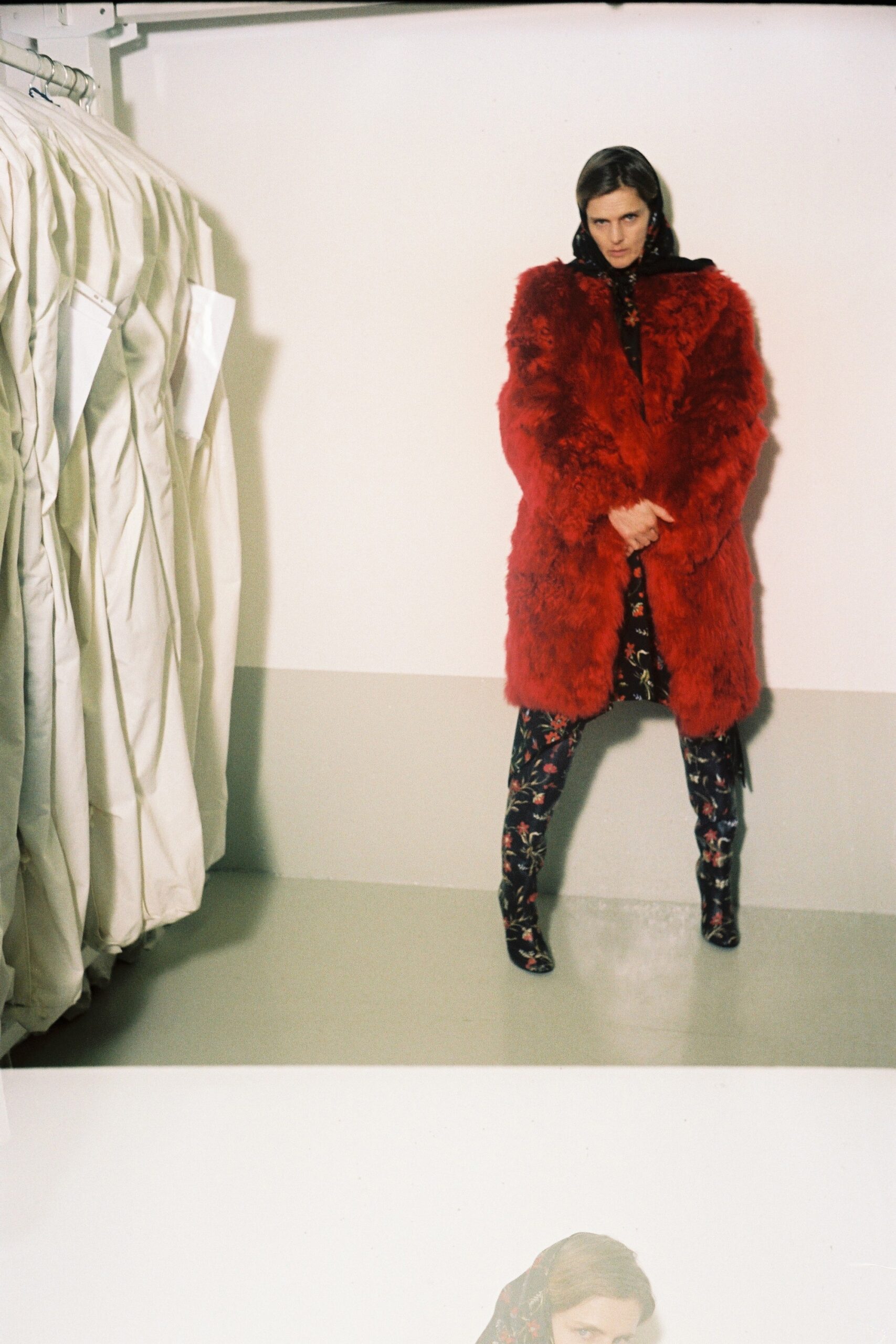 red faux-fur coat with floral dress