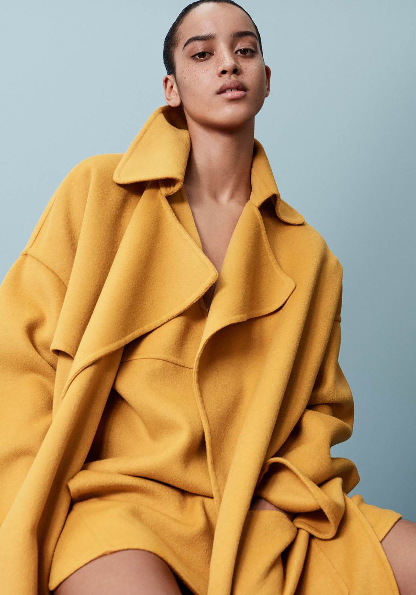 yellow oversized coat and fitted dress