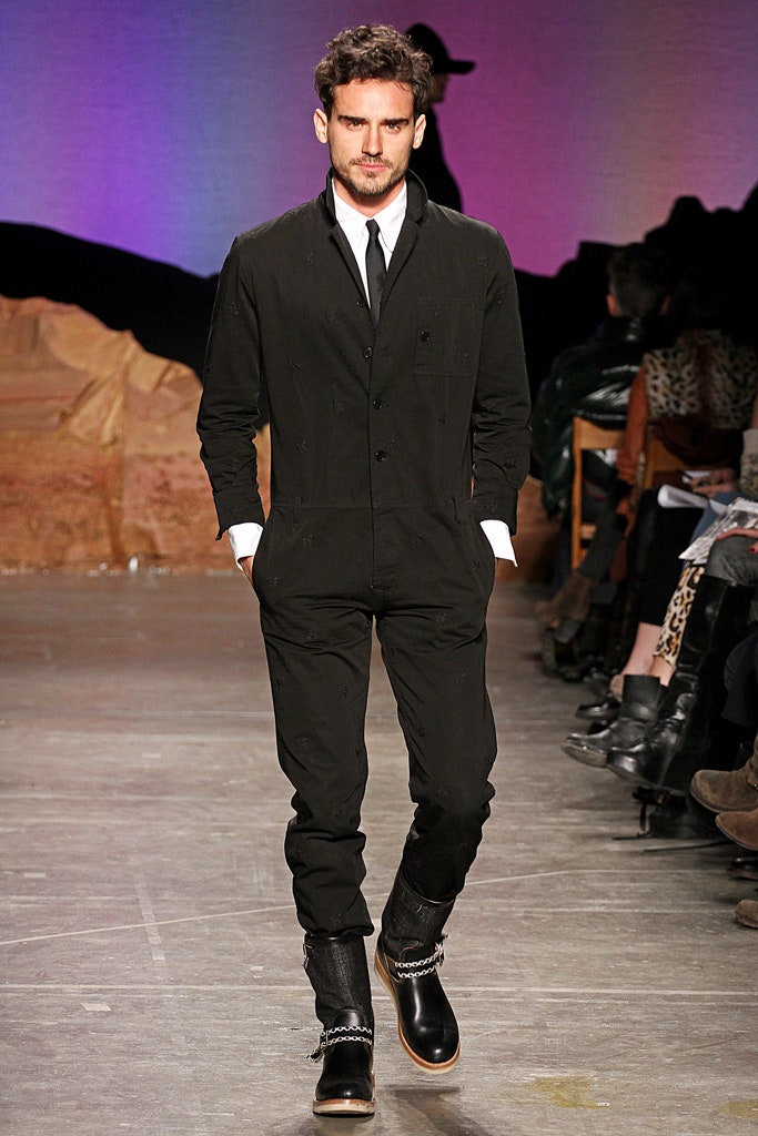 black fitted jumpsuit with boots