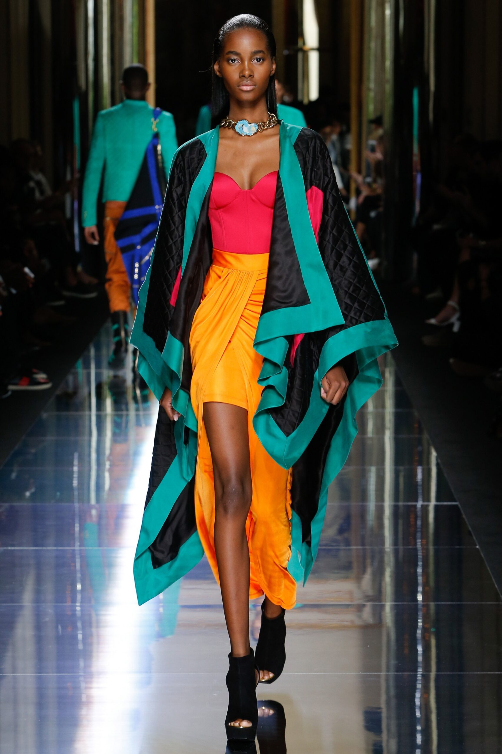orange mini dress with black cape