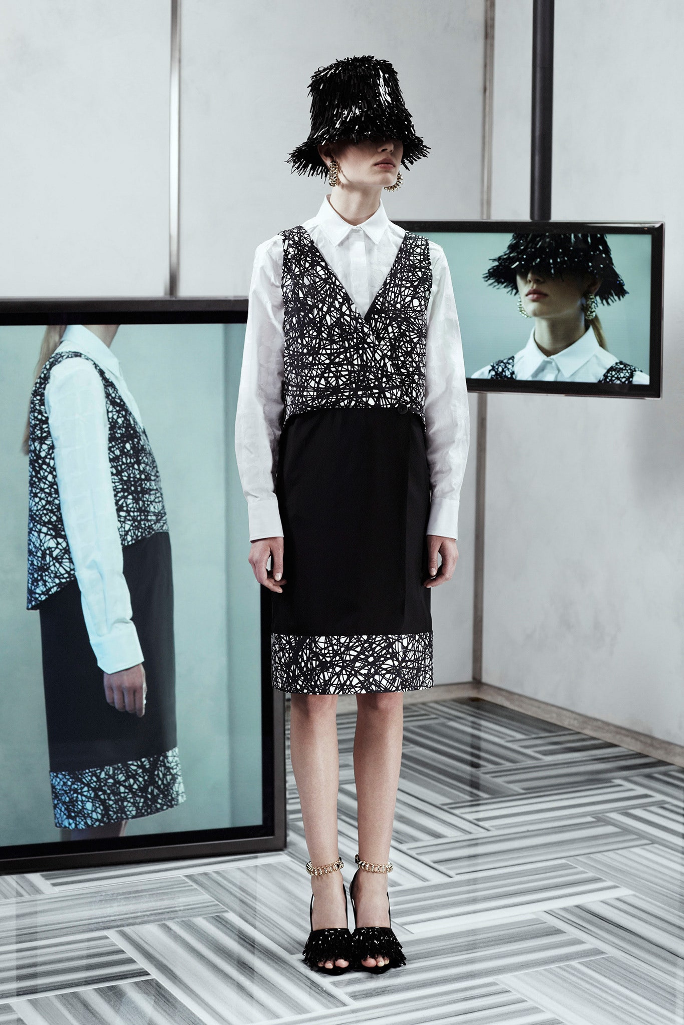 black and white layered dress with fringed hat