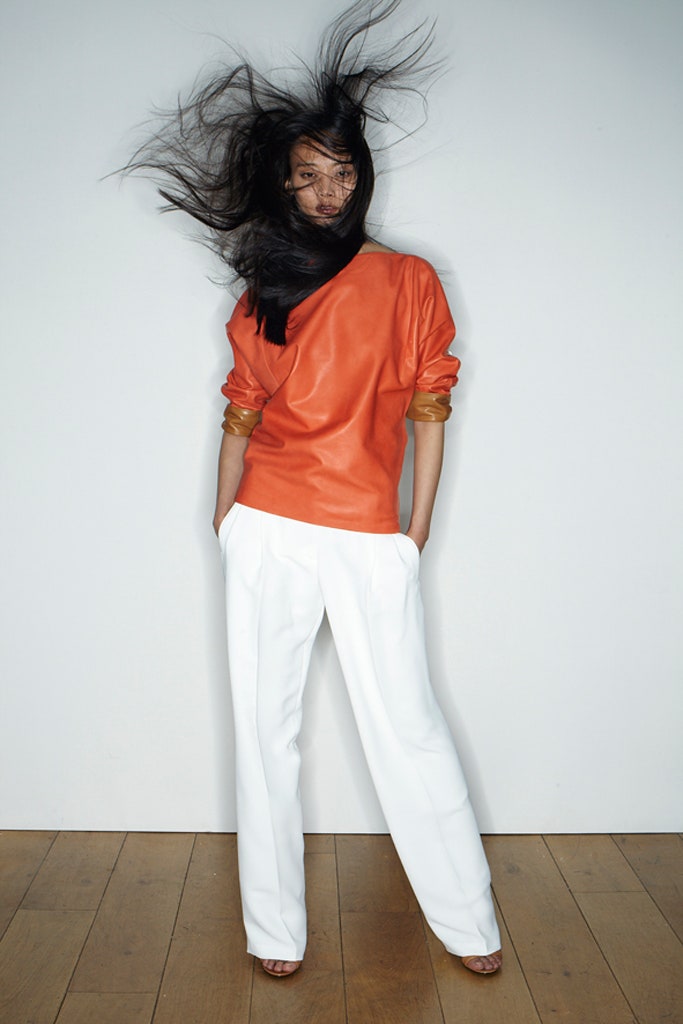 orange leather relaxed top with tailored pants