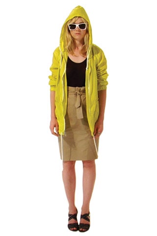 yellow hoodie with black top and beige skirt