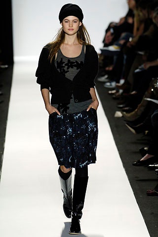 gray sleeveless top with black cardigan