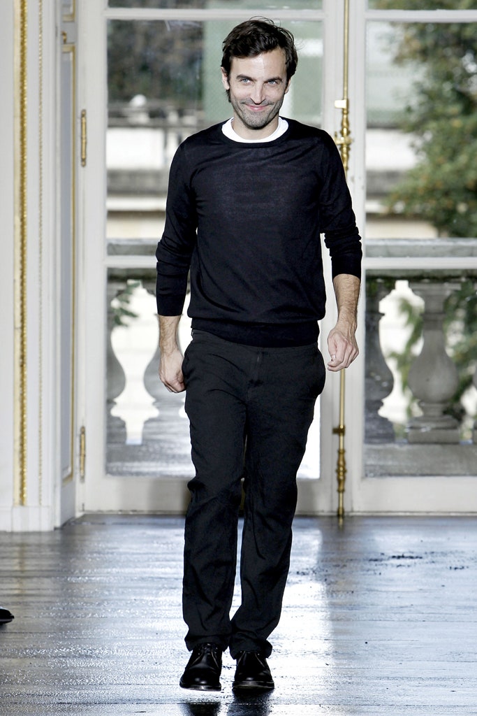 black fitted sweater and tailored pants