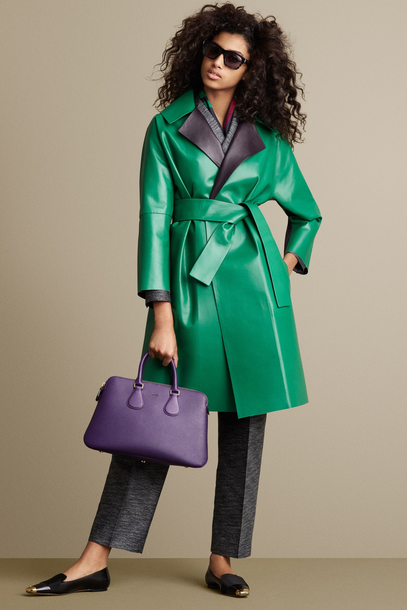 green leather coat with gray pants