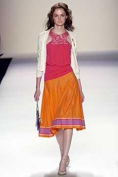 pink sleeveless top with orange skirt