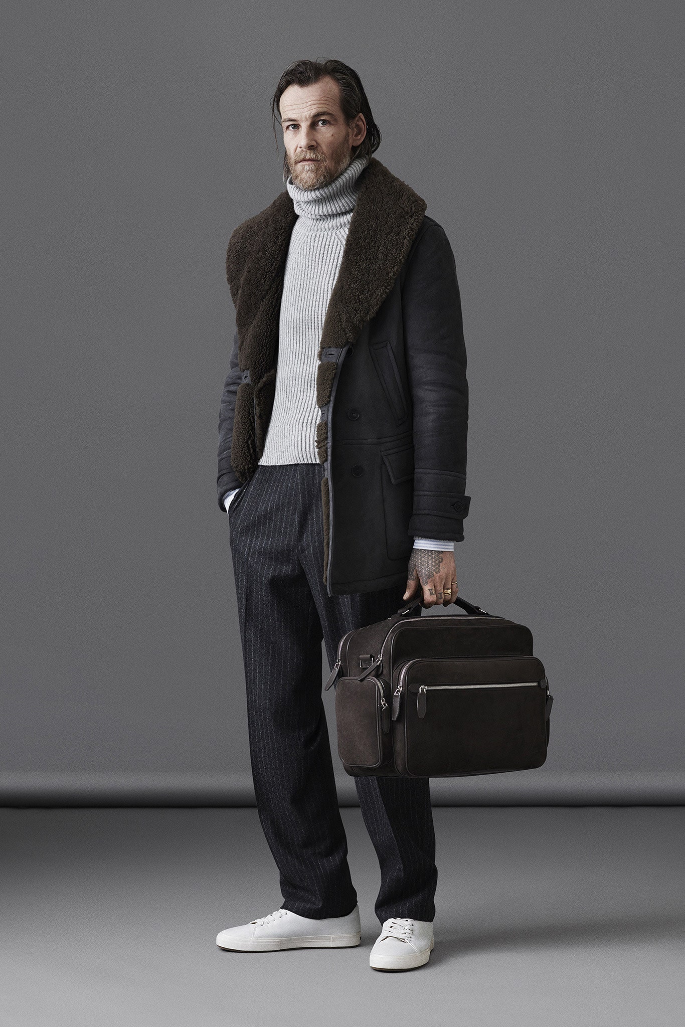black leather coat gray sweater