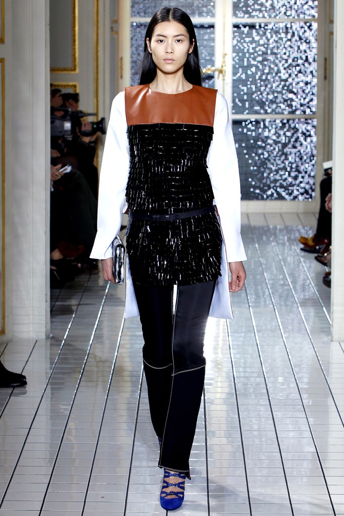 black and white layered top with slim pants