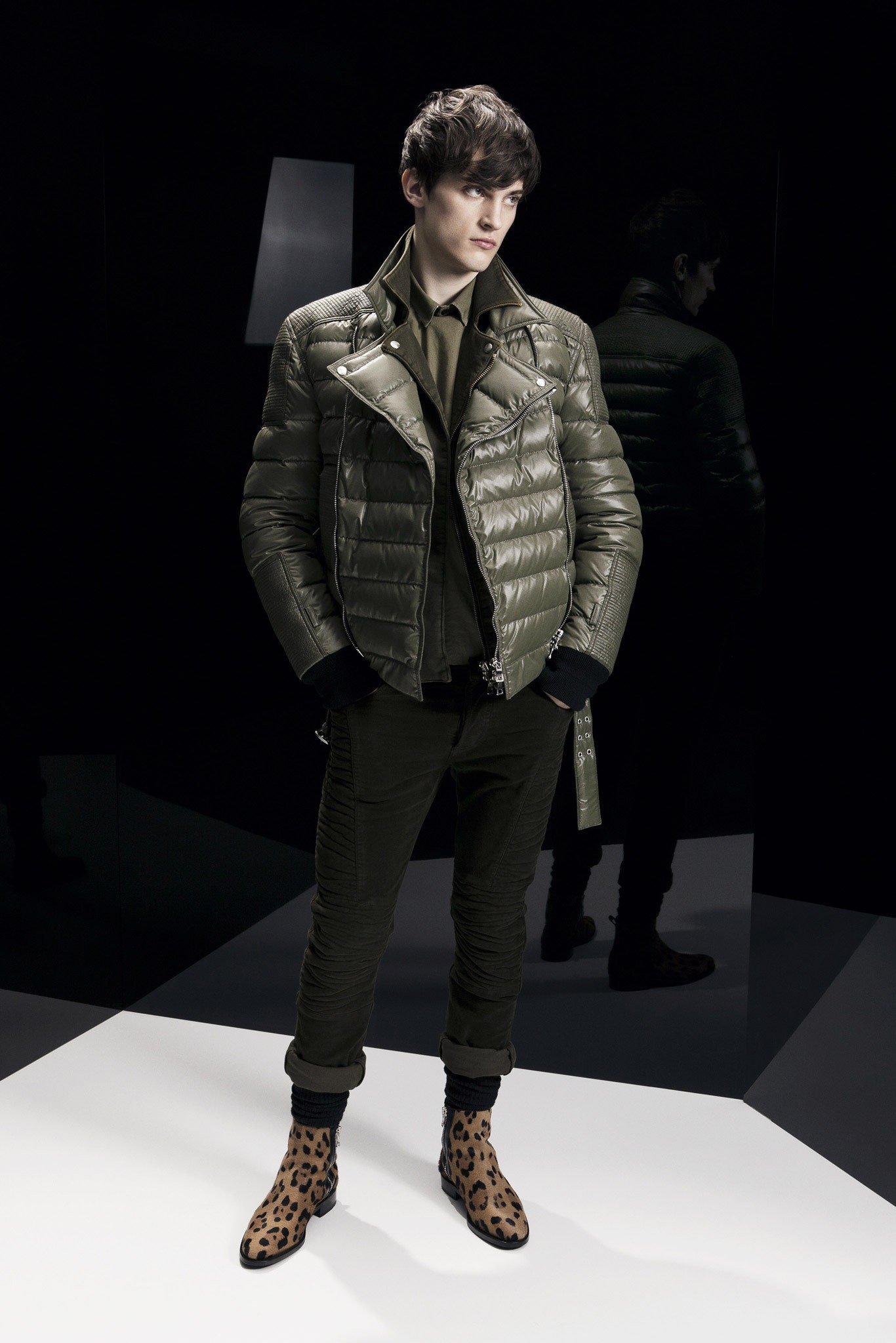 green padded jacket with animal-print boots