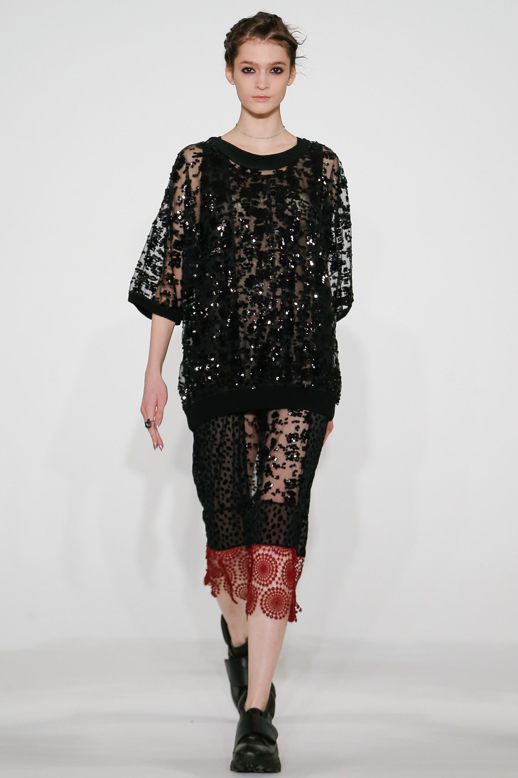 black sequined oversized top and layered skirt