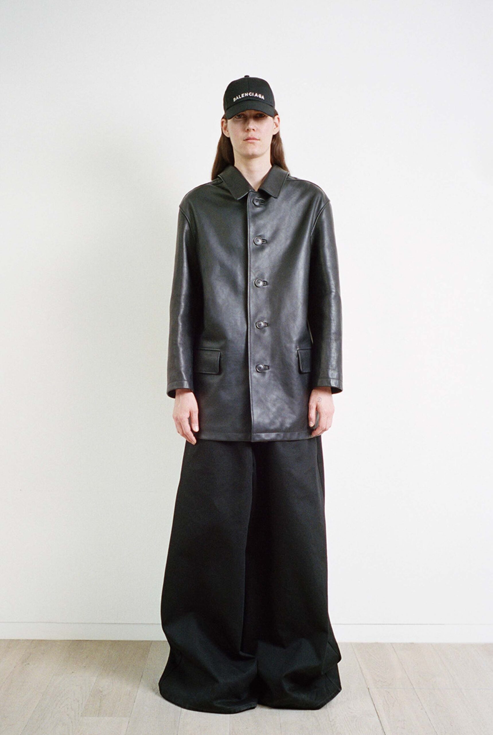black leather coat and wide-leg pants