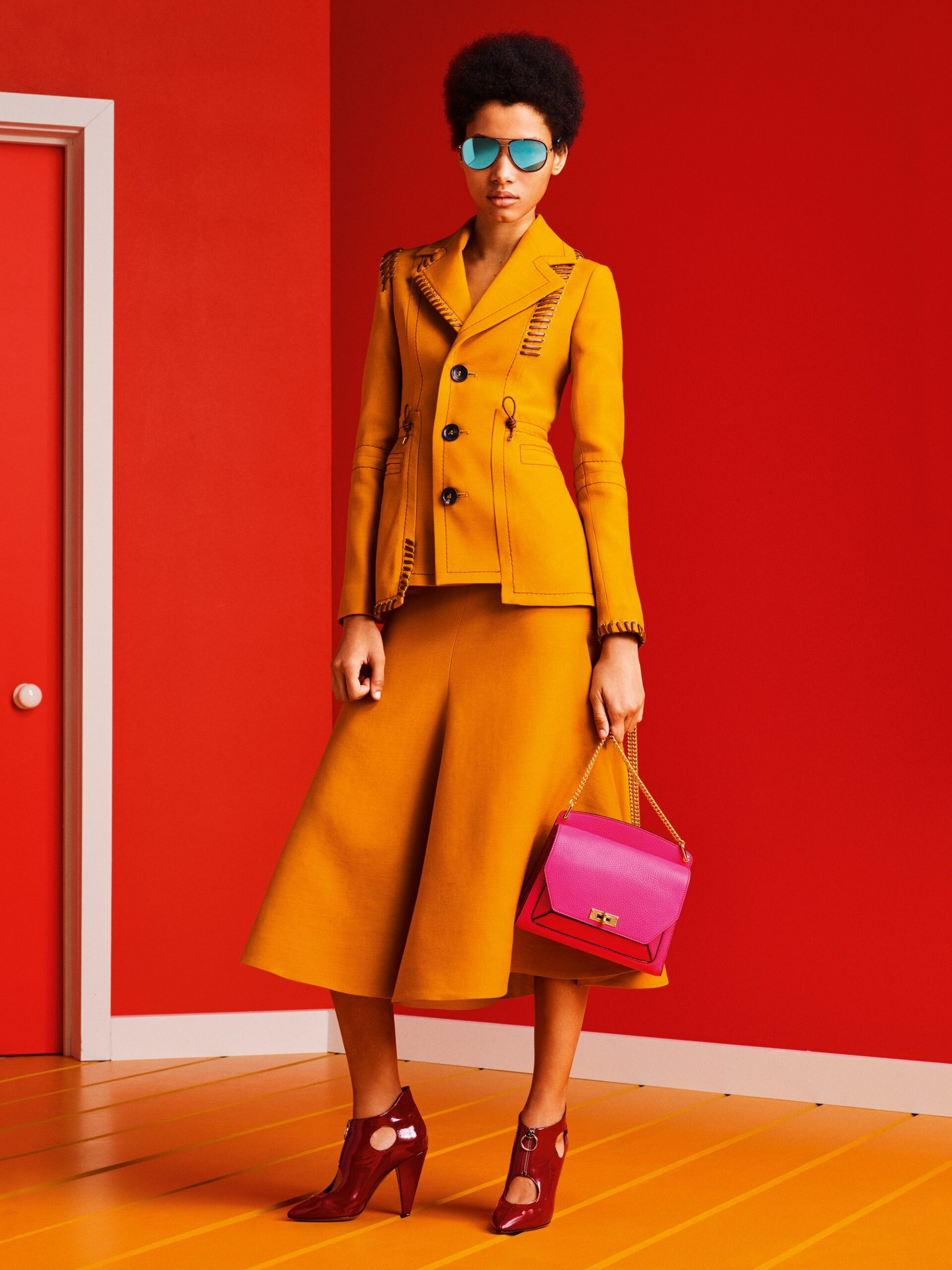 yellow tailored blazer and flared skirt
