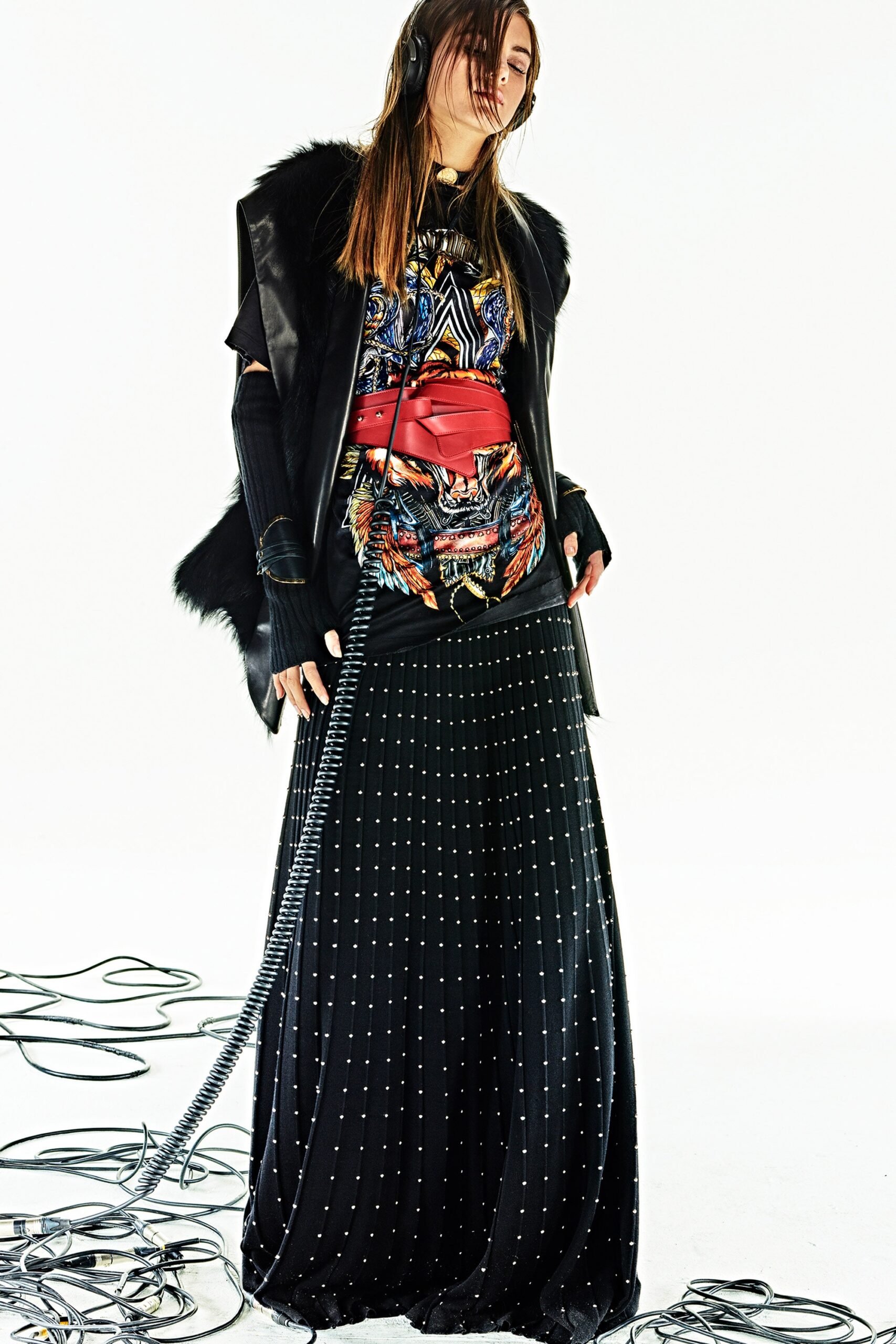 multi-colored silk top with black pleated skirt