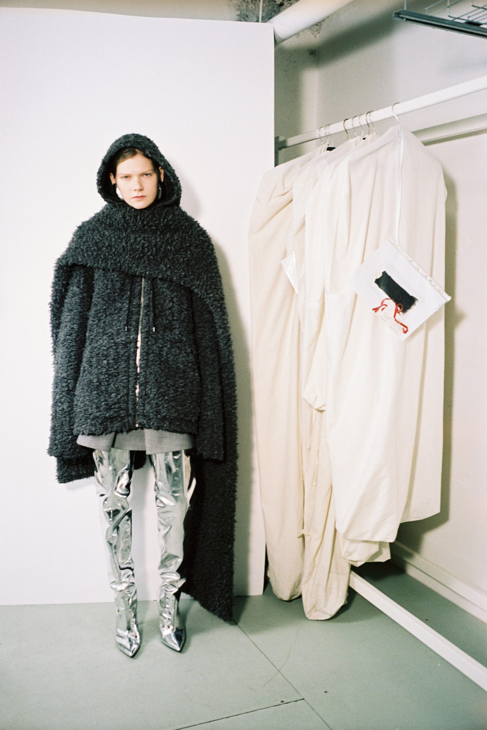 black oversized coat with silver boots