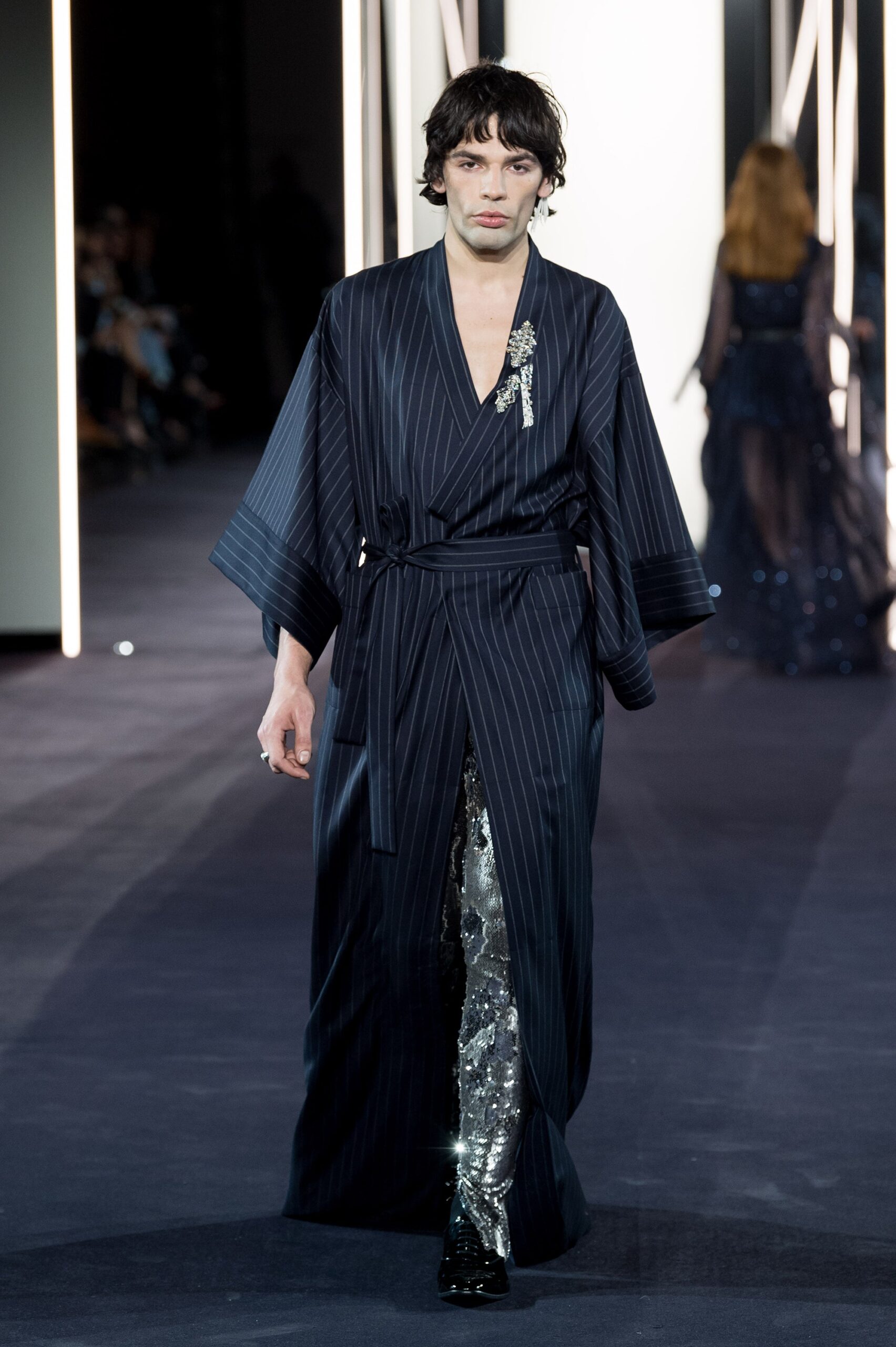 black and blue striped coat with sequined pants