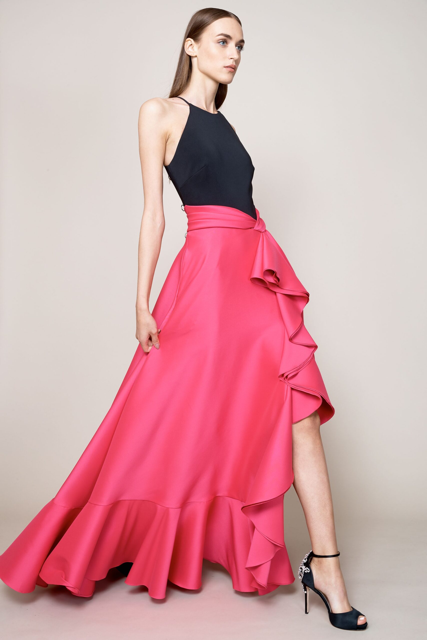black fitted top with pink ruffled skirt