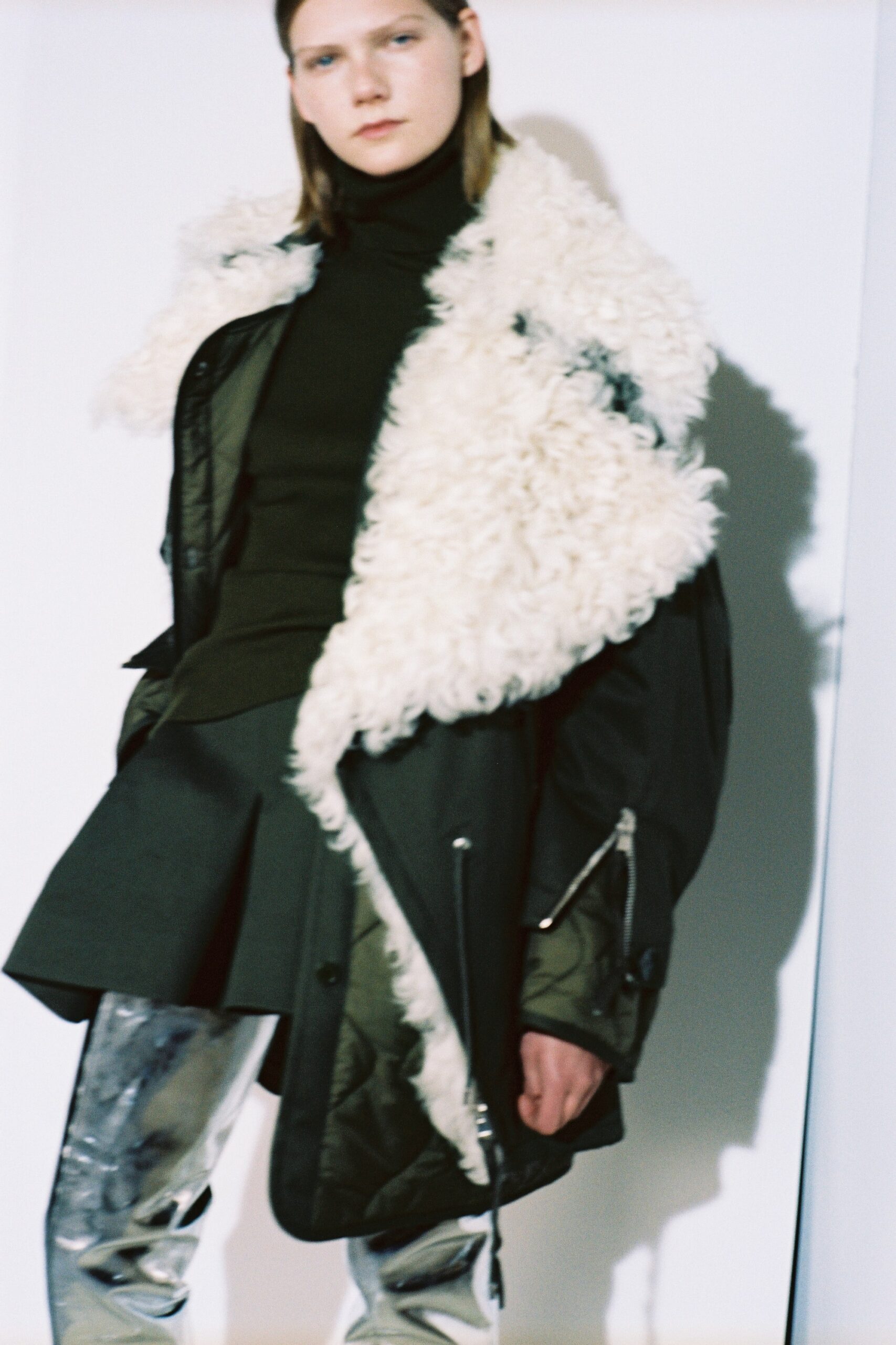 green coat with fur collar