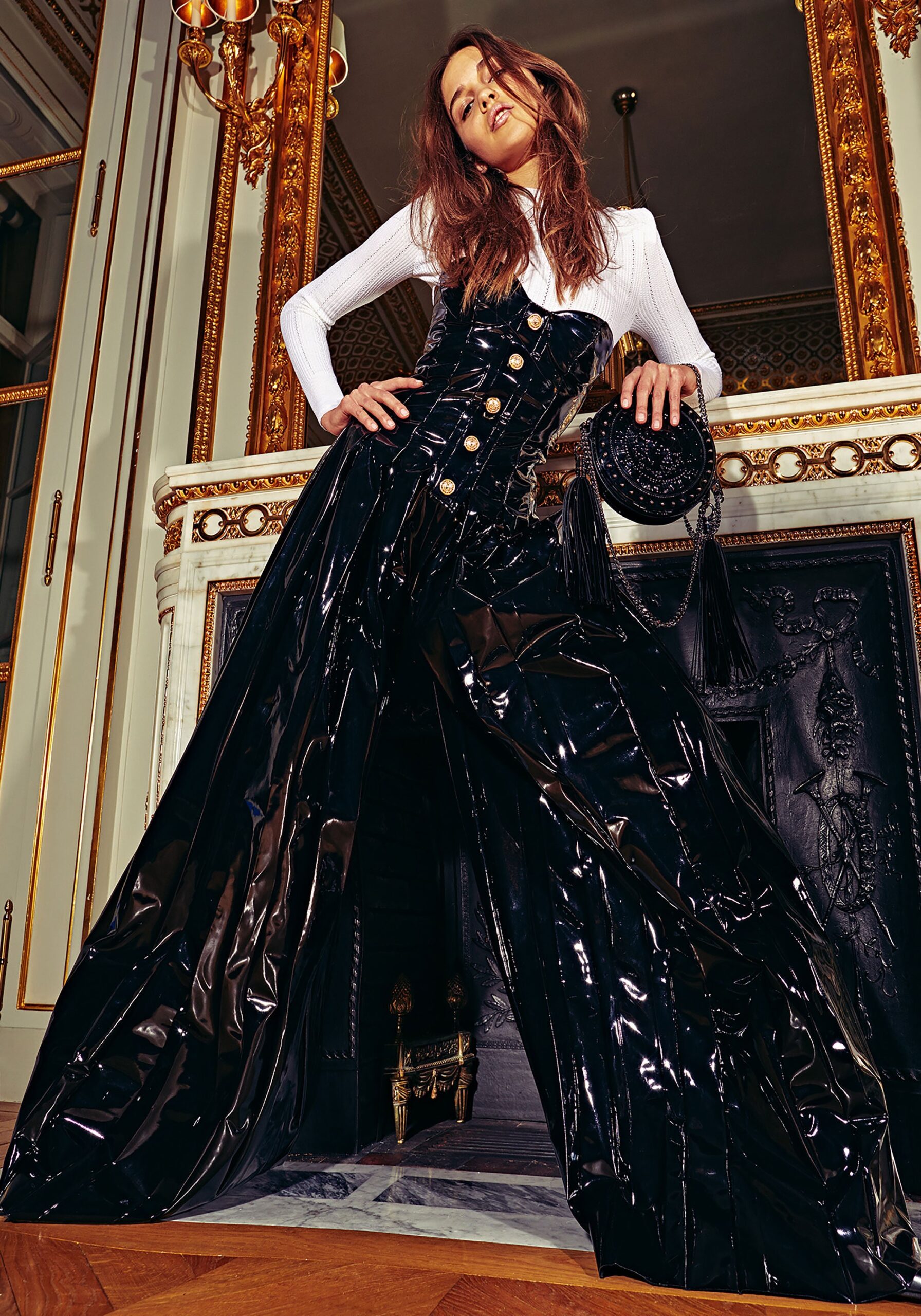 black vinyl fitted jumpsuit and white blouse