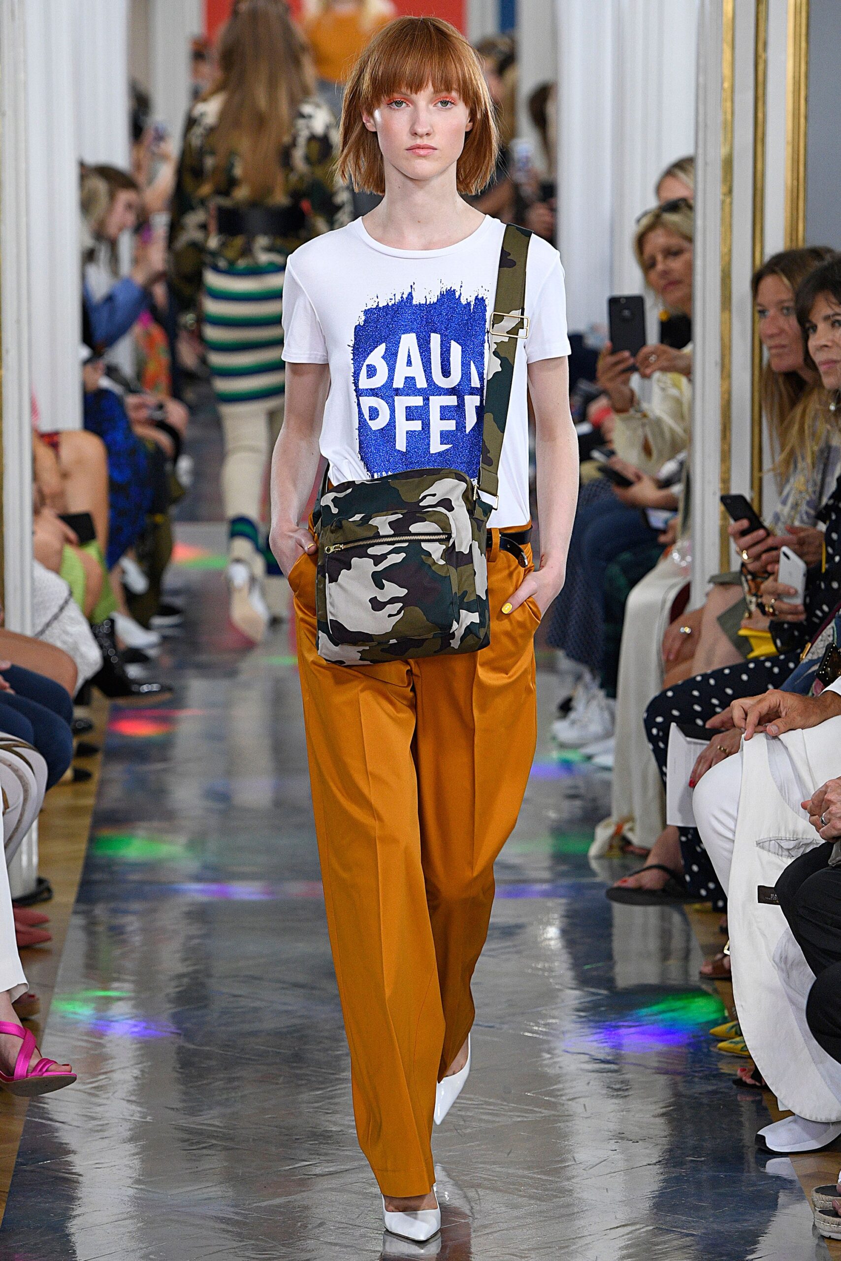 white printed t-shirt with orange pants