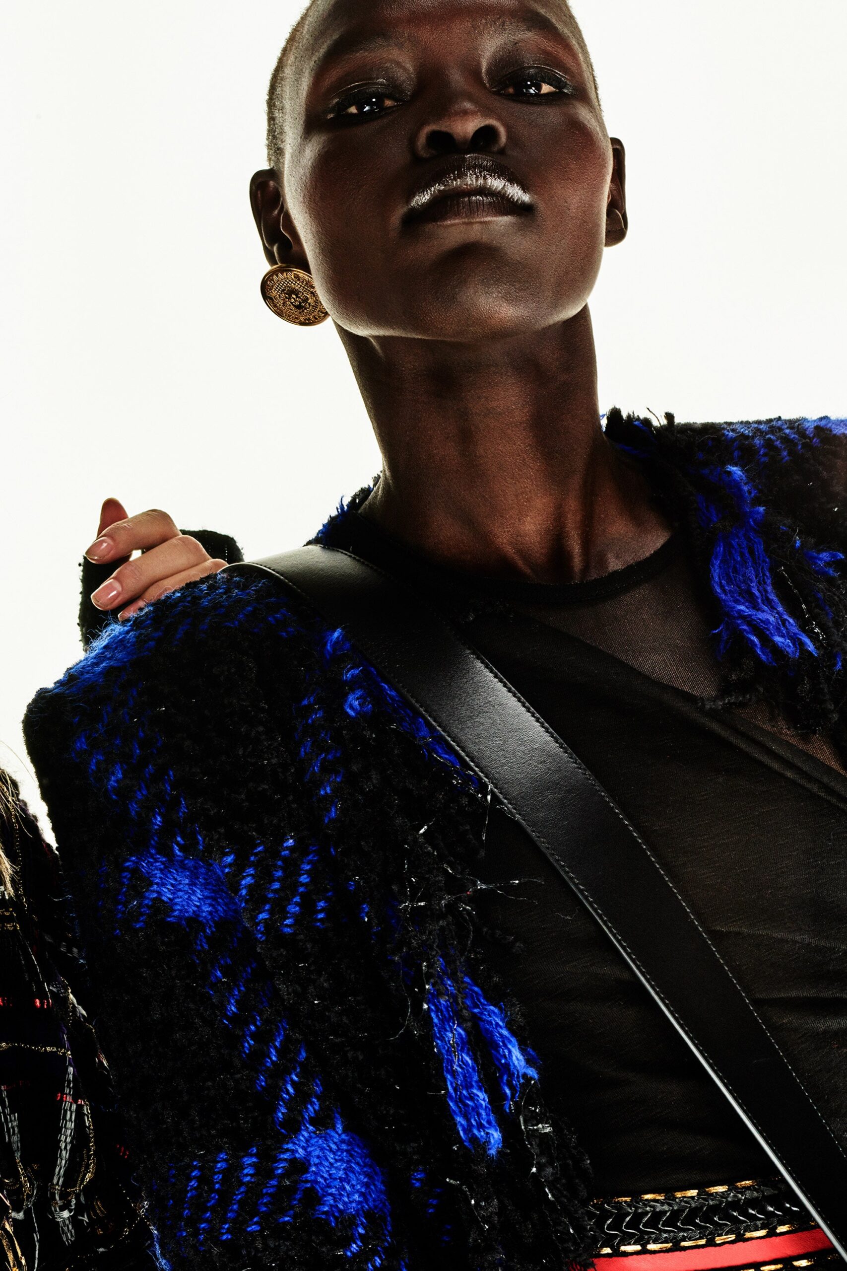 blue wool fitted jacket and black sheer top