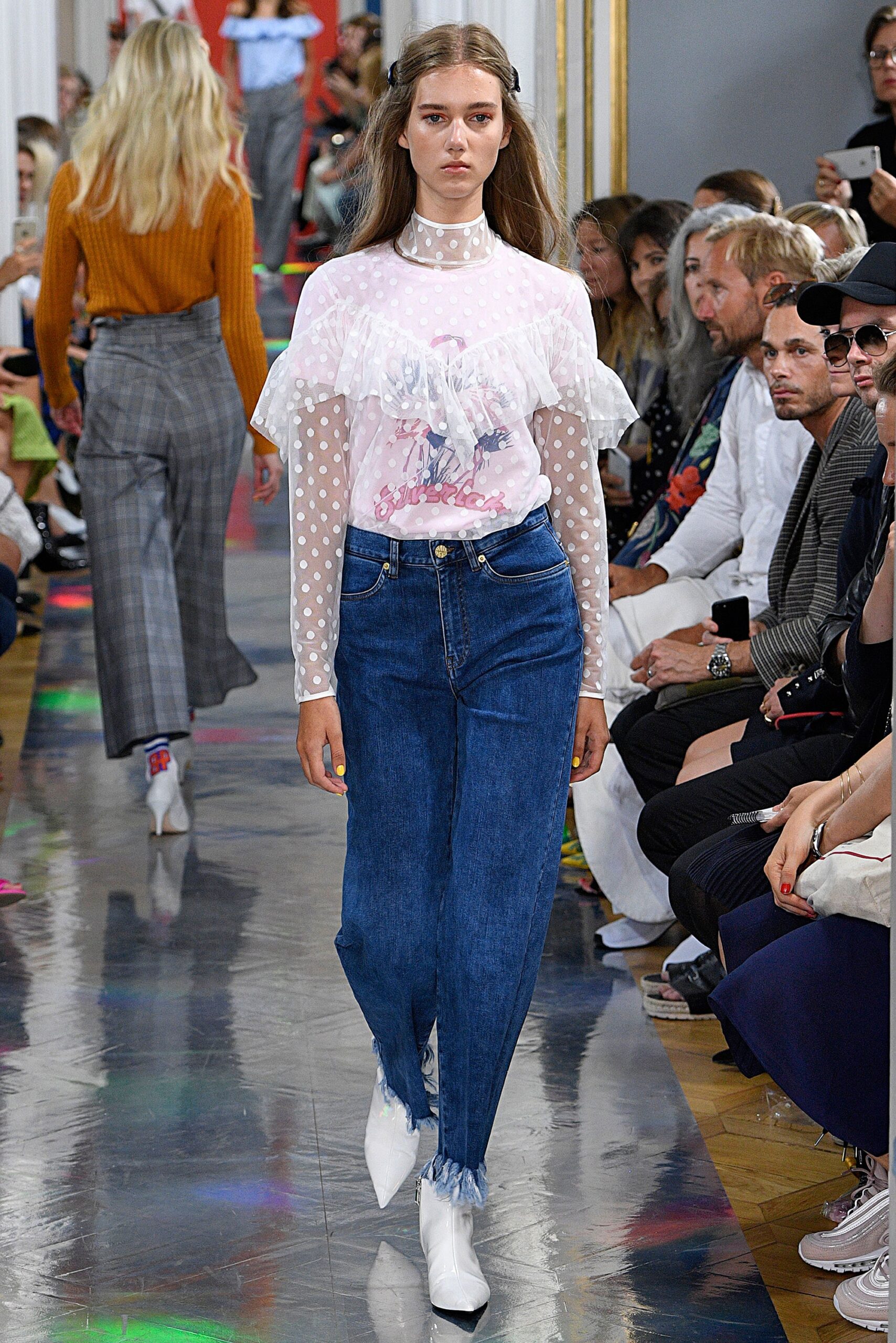 white ruffled top with denim pants