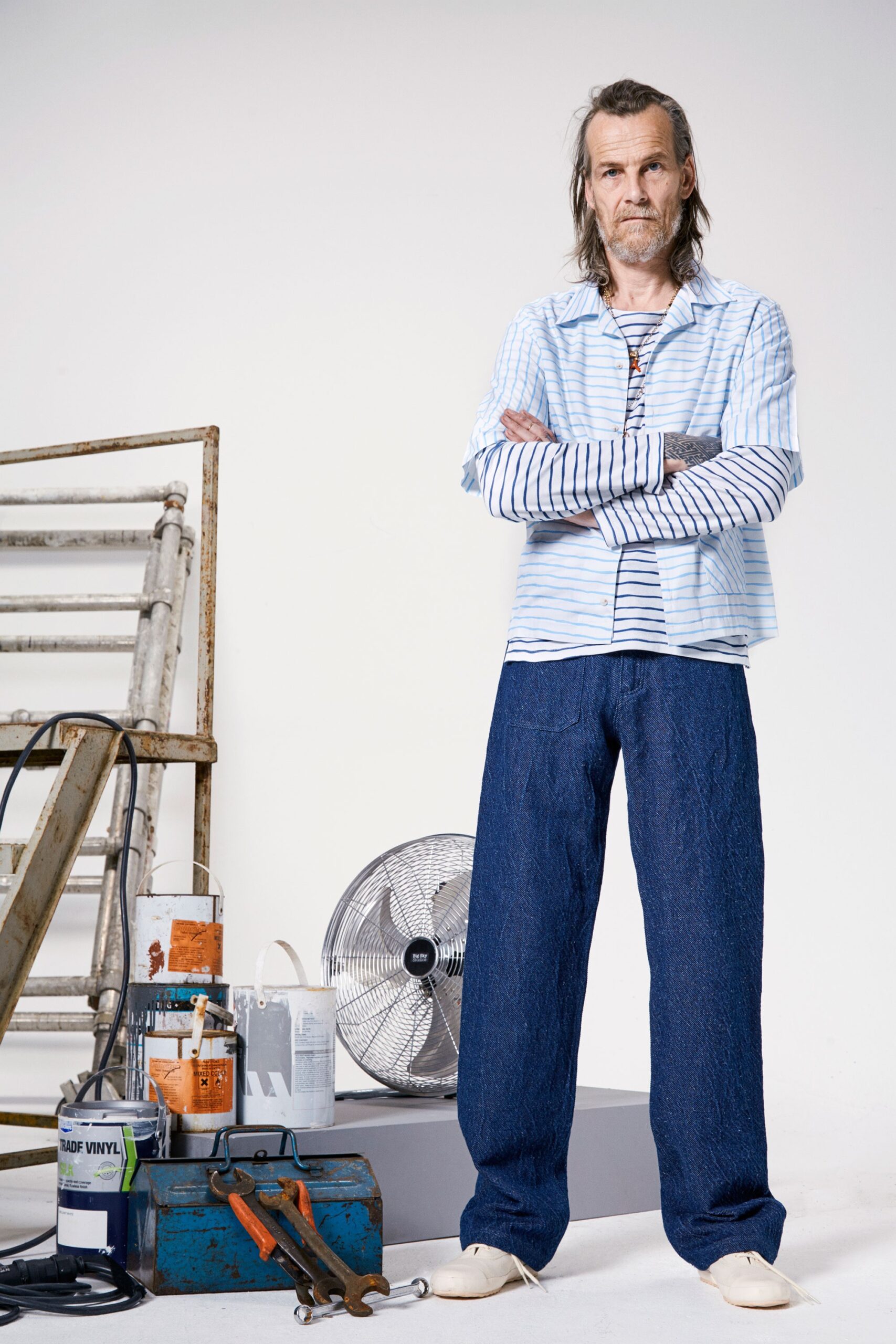 blue striped shirt and denim pants