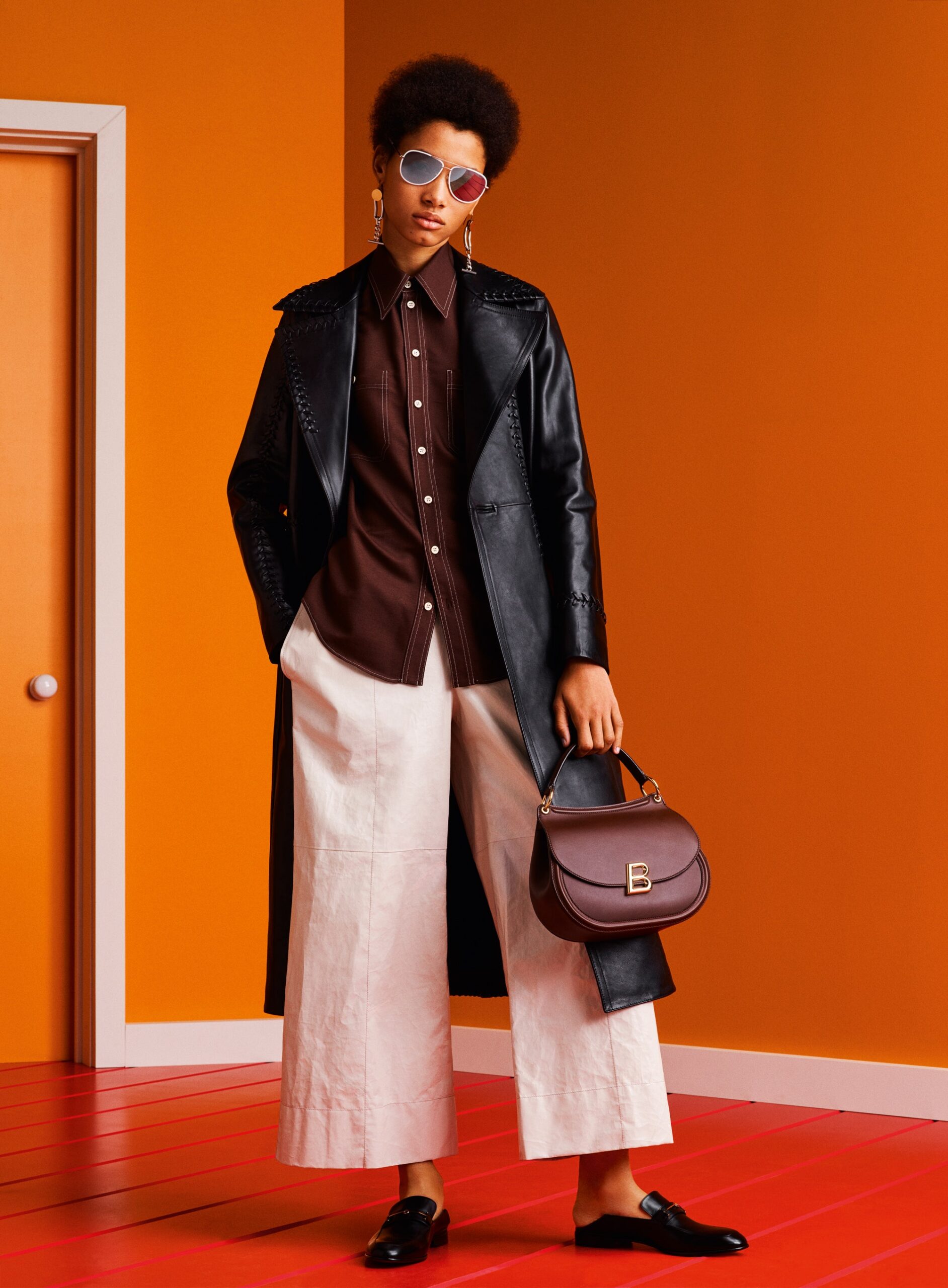 black leather coat with brown shirt
