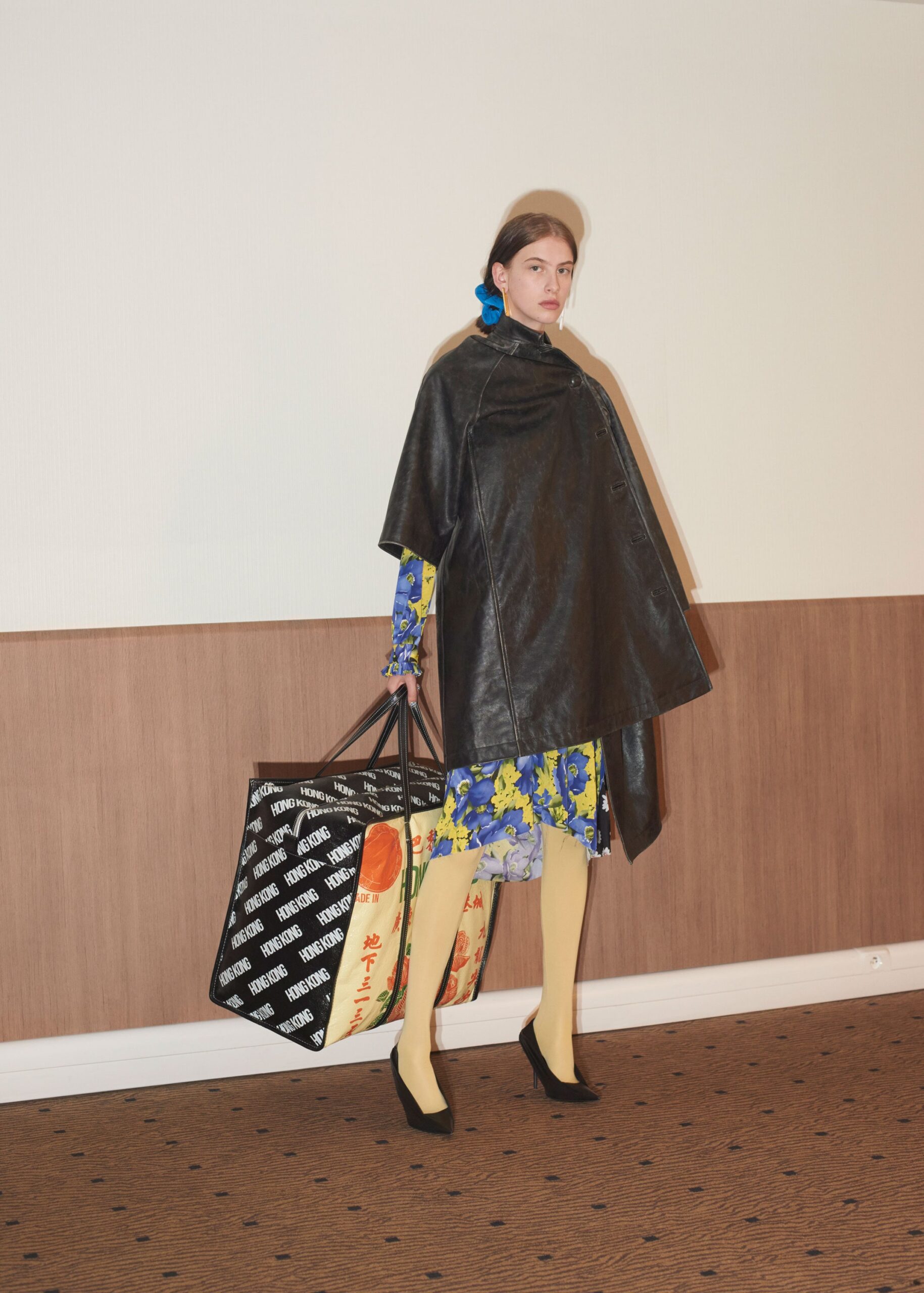 black leather cape with floral dress