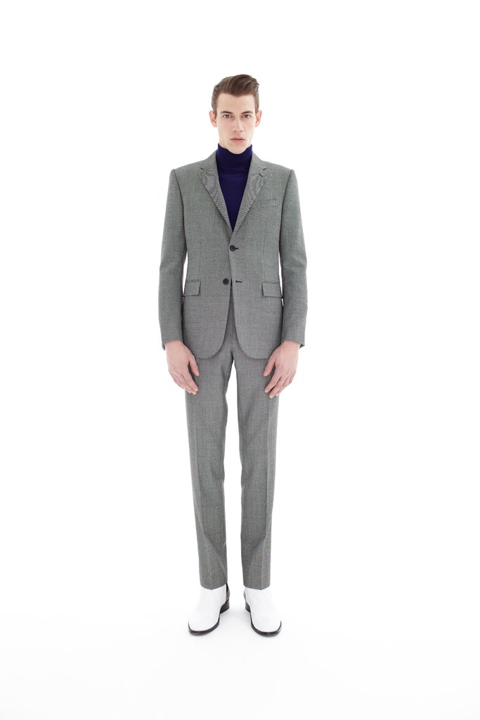 gray tailored suit with blue turtleneck