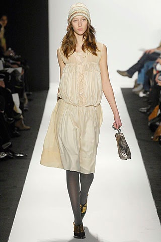 beige relaxed silk dress with knit hat