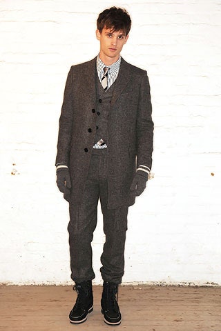 gray tailored suit with striped shirt